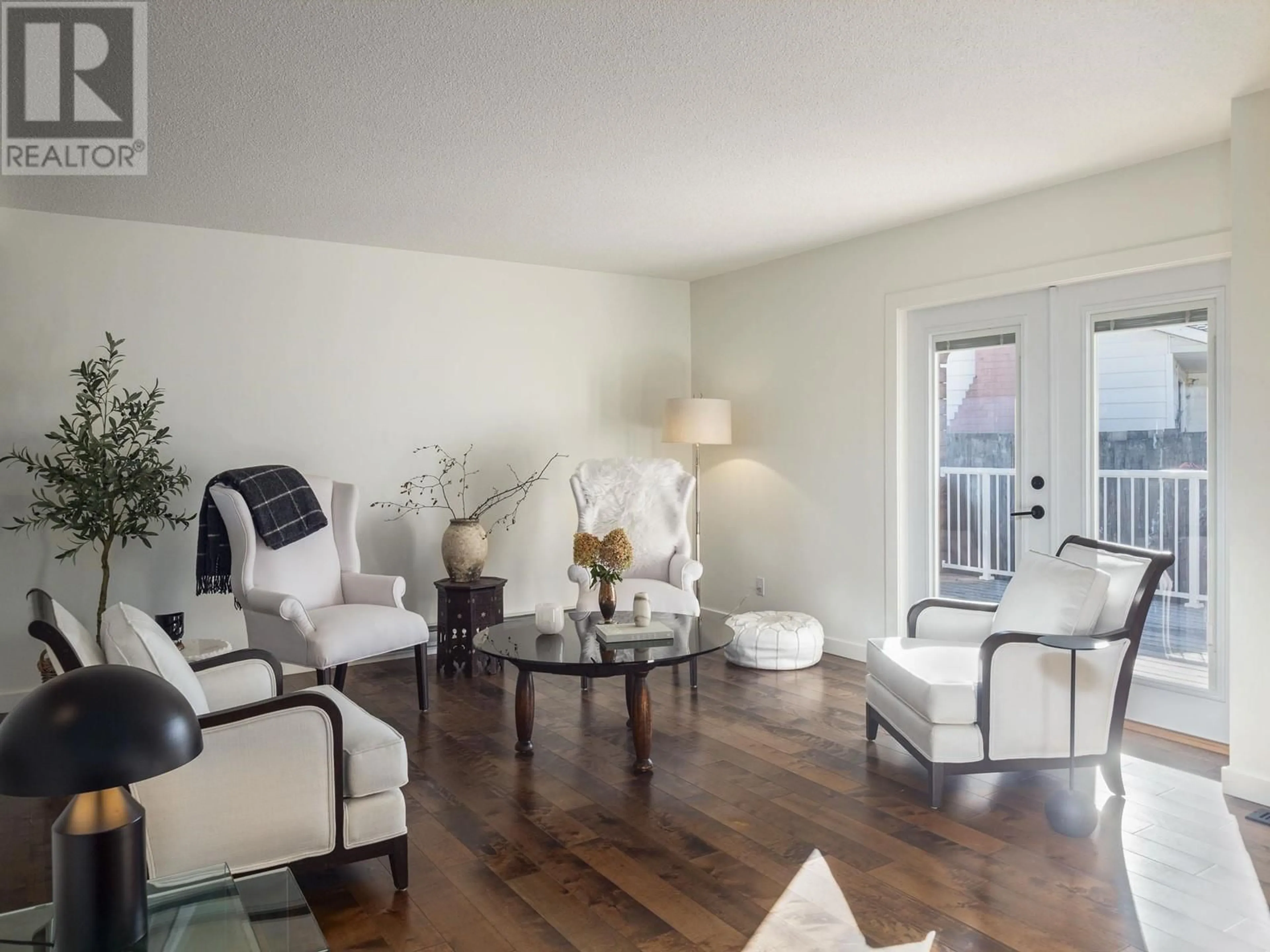 Living room with furniture, wood/laminate floor for 617 RADCLIFFE DRIVE, Prince George British Columbia V2M3N8