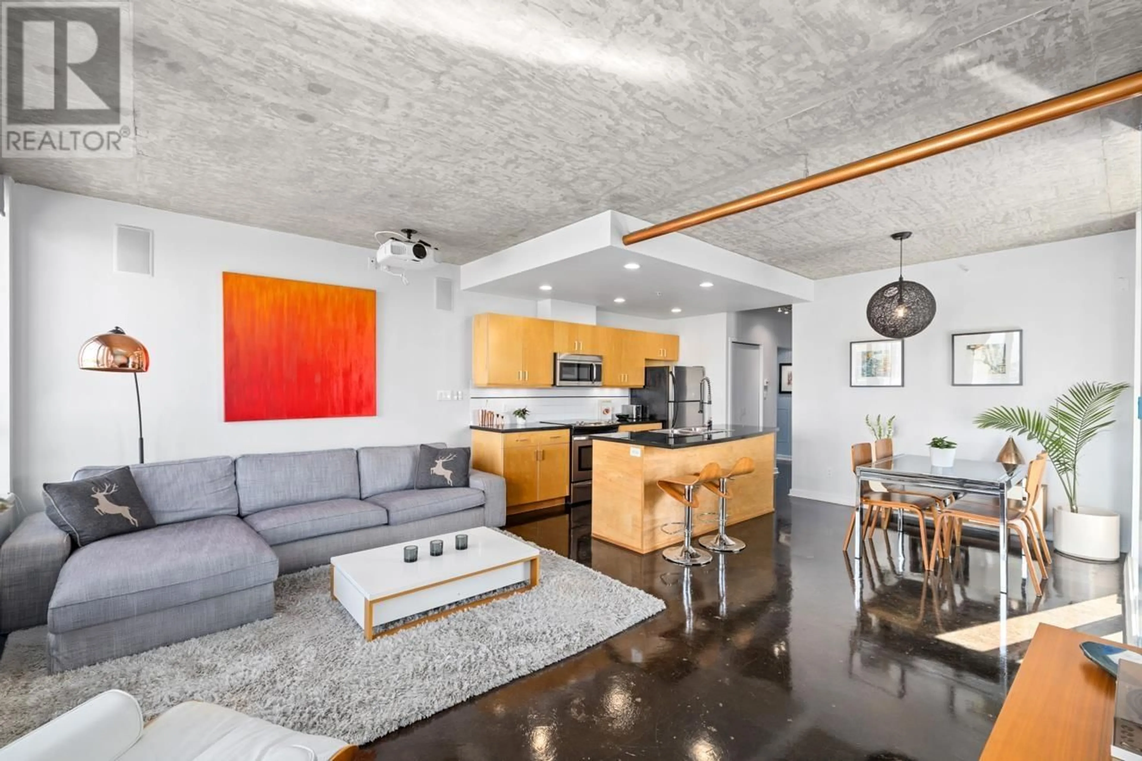 Living room with furniture, cement floor for 706 - 919 STATION STREET, Vancouver British Columbia V6A4L9