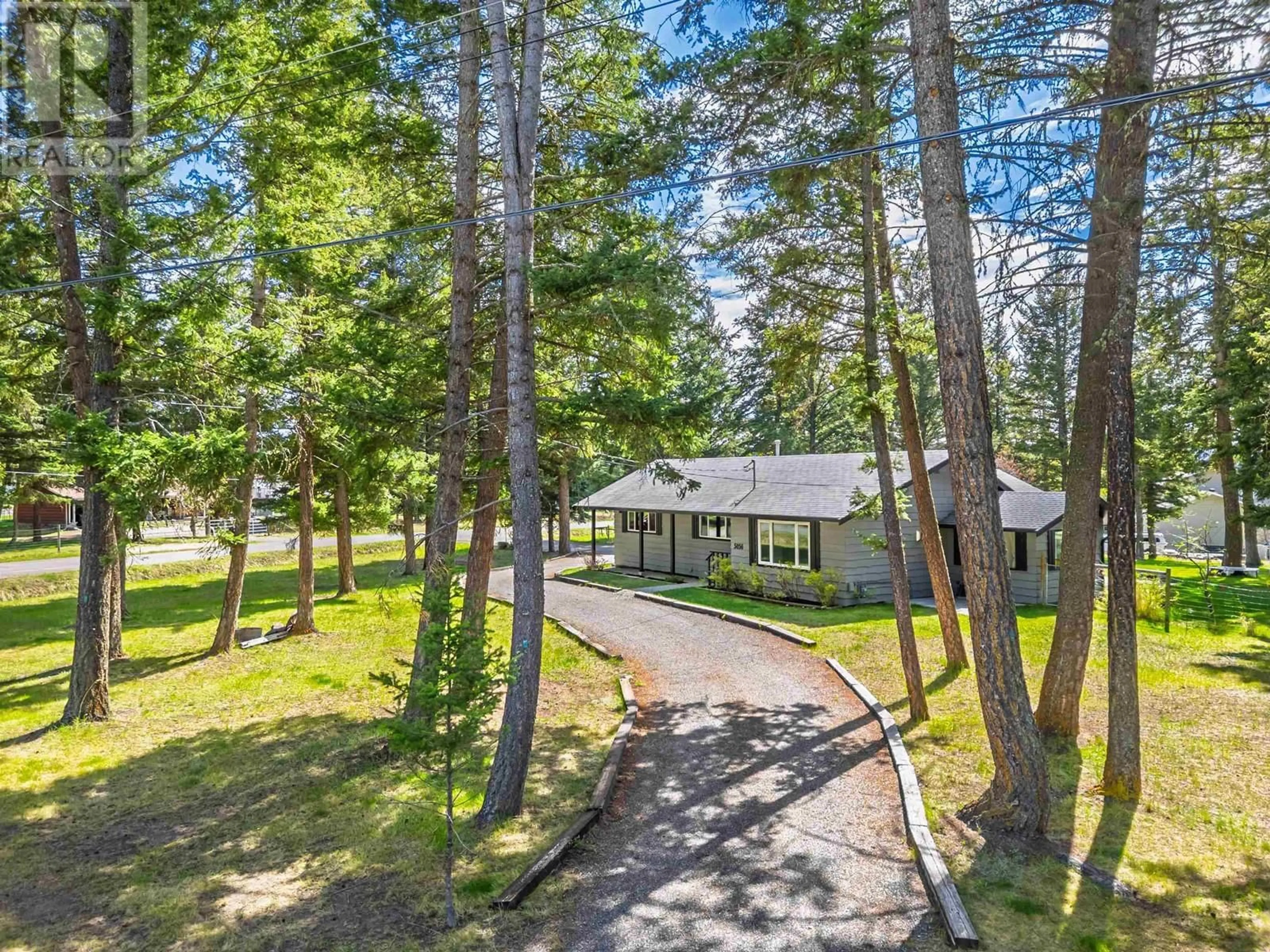 A pic from outside/outdoor area/front of a property/back of a property/a pic from drone, forest/trees view for 5056 KINNCUM ROAD, 108 Mile Ranch British Columbia V0K2Z0