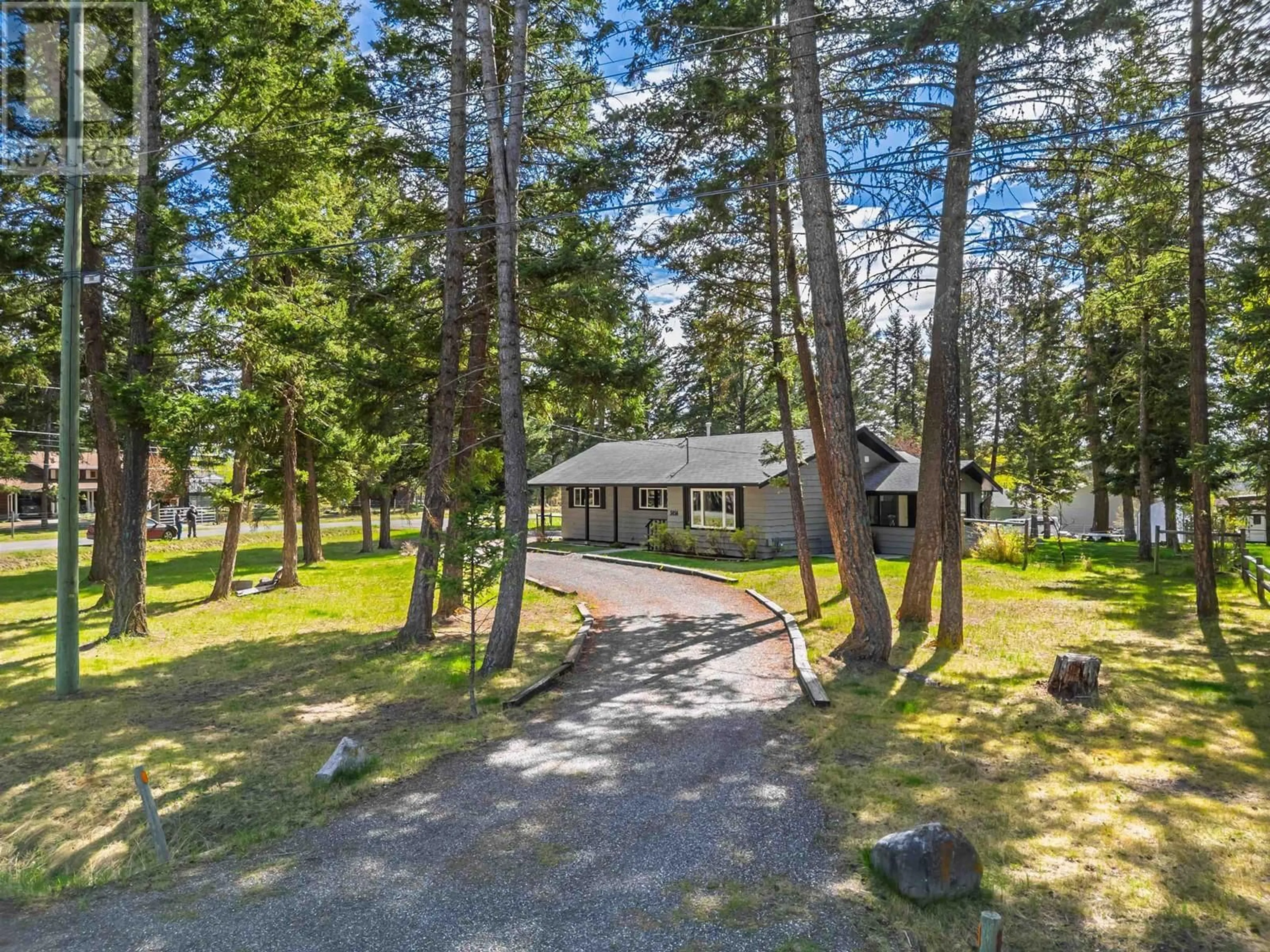 A pic from outside/outdoor area/front of a property/back of a property/a pic from drone, forest/trees view for 5056 KINNCUM ROAD, 108 Mile Ranch British Columbia V0K2Z0