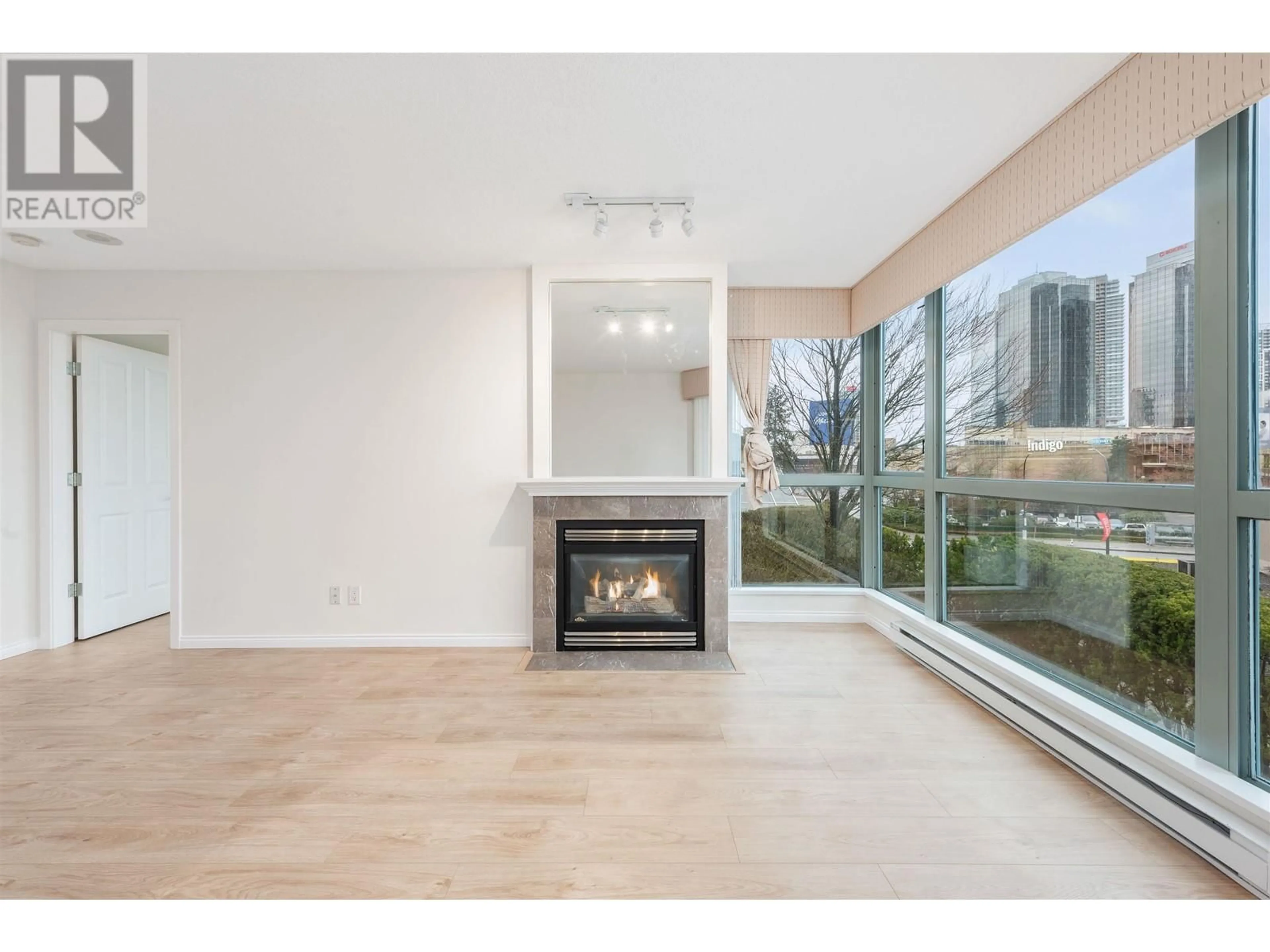 Living room with furniture, wood/laminate floor for 305 - 4788 HAZEL STREET, Burnaby British Columbia V5H4V9