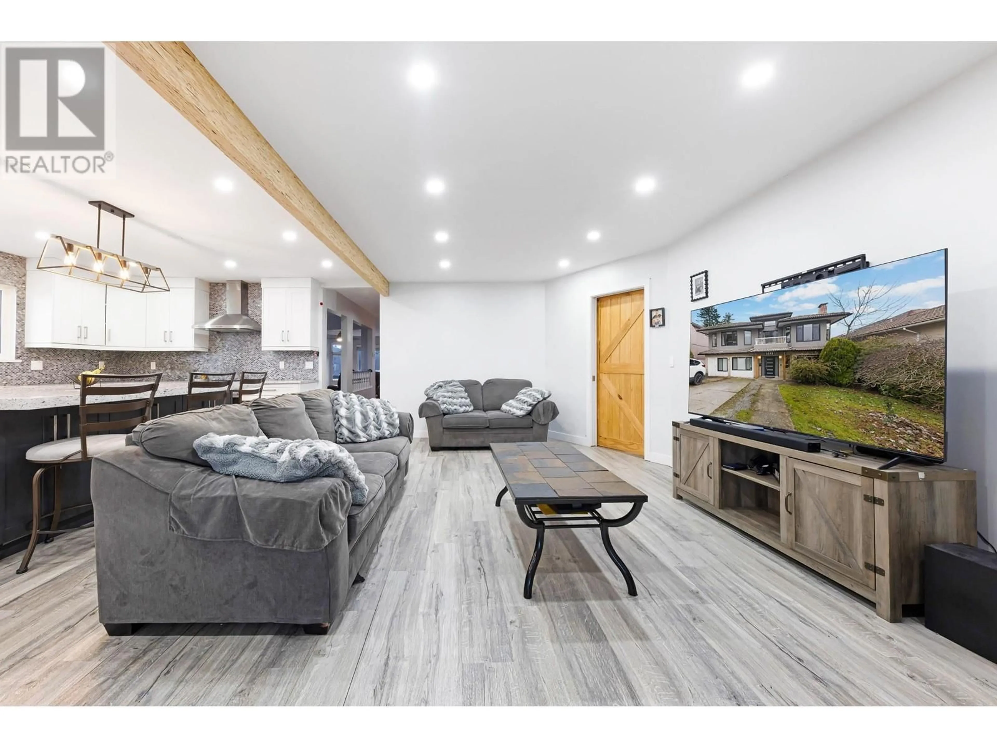 Living room with furniture, wood/laminate floor for 5649 LAUREL STREET, Burnaby British Columbia V5G1N4