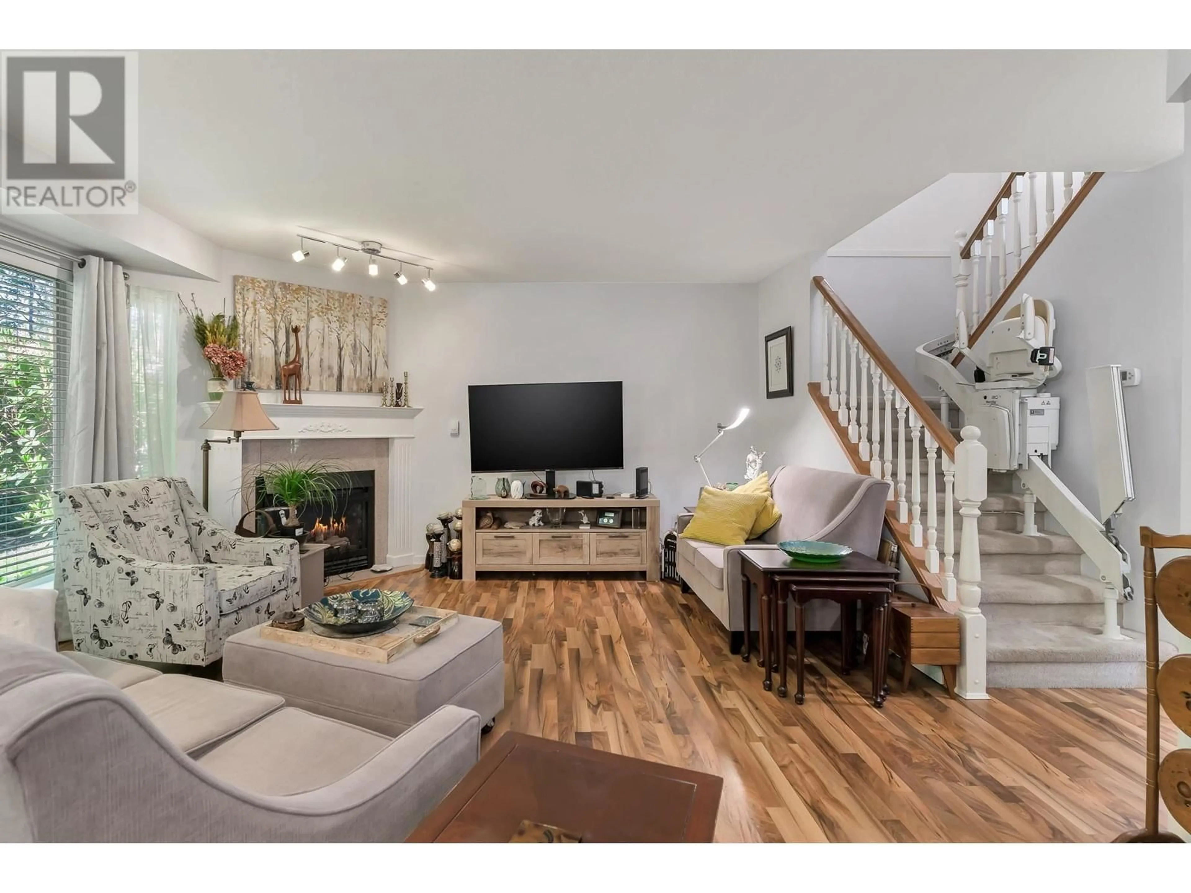 Living room with furniture, wood/laminate floor for 38 - 22740 116 AVENUE, Maple Ridge British Columbia V2X2X7