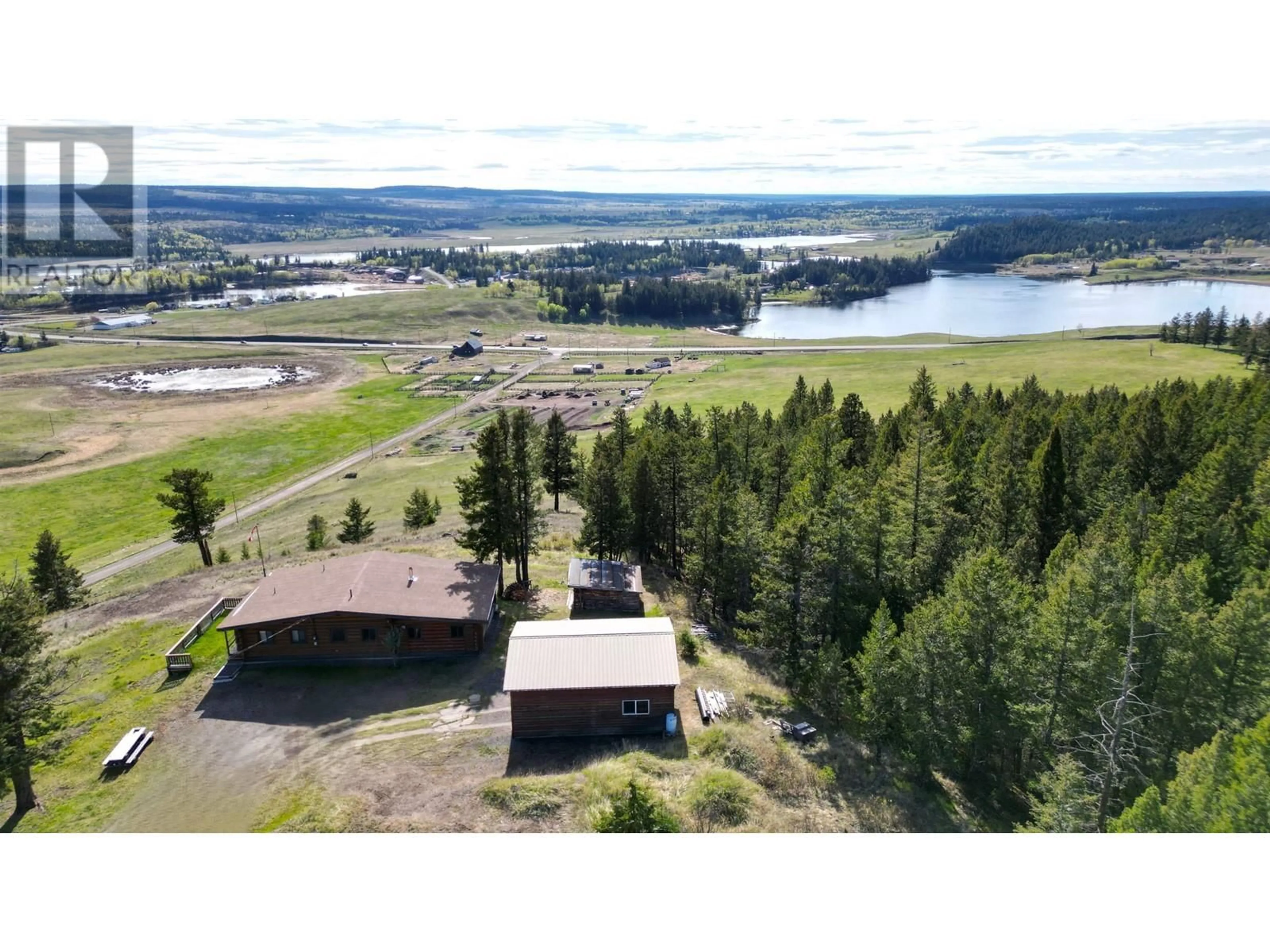 A pic from outside/outdoor area/front of a property/back of a property/a pic from drone, water/lake/river/ocean view for 5549 BACKVALLEY ROAD, 100 Mile House British Columbia V0K2Z0