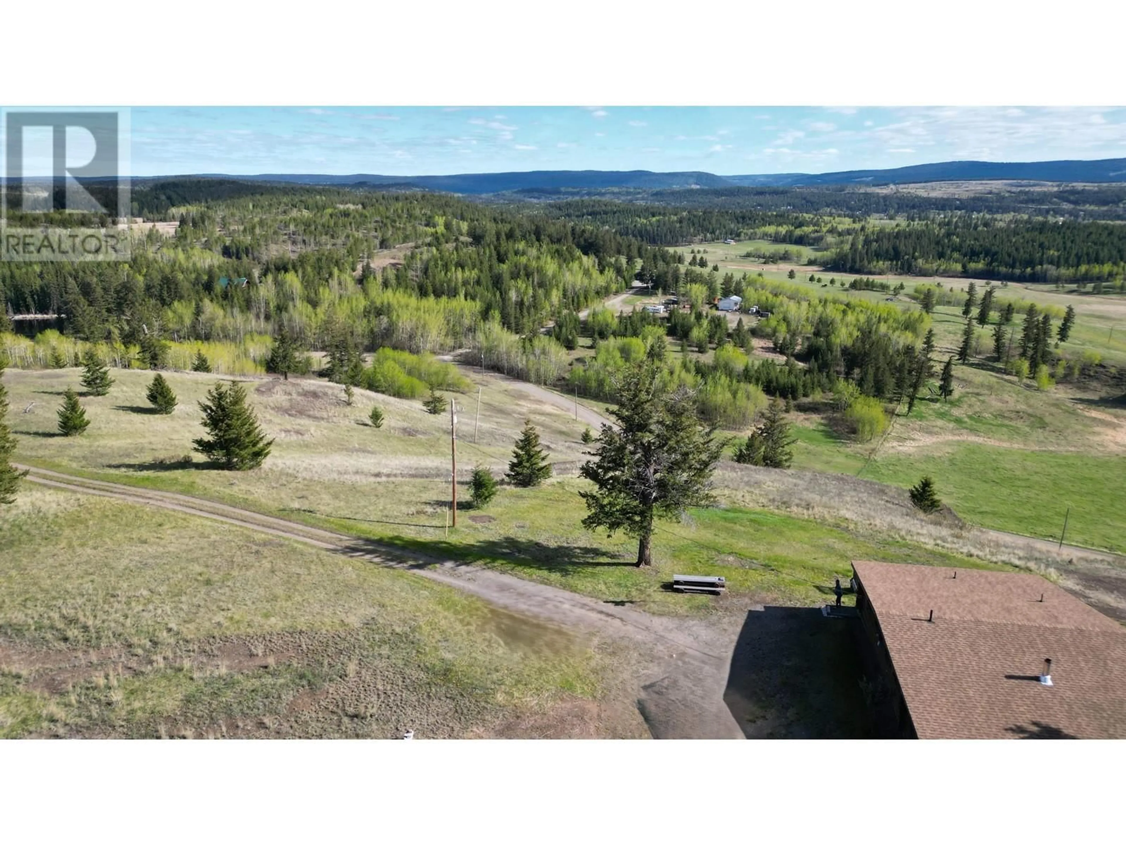A pic from outside/outdoor area/front of a property/back of a property/a pic from drone, forest/trees view for 5549 BACKVALLEY ROAD, 100 Mile House British Columbia V0K2Z0
