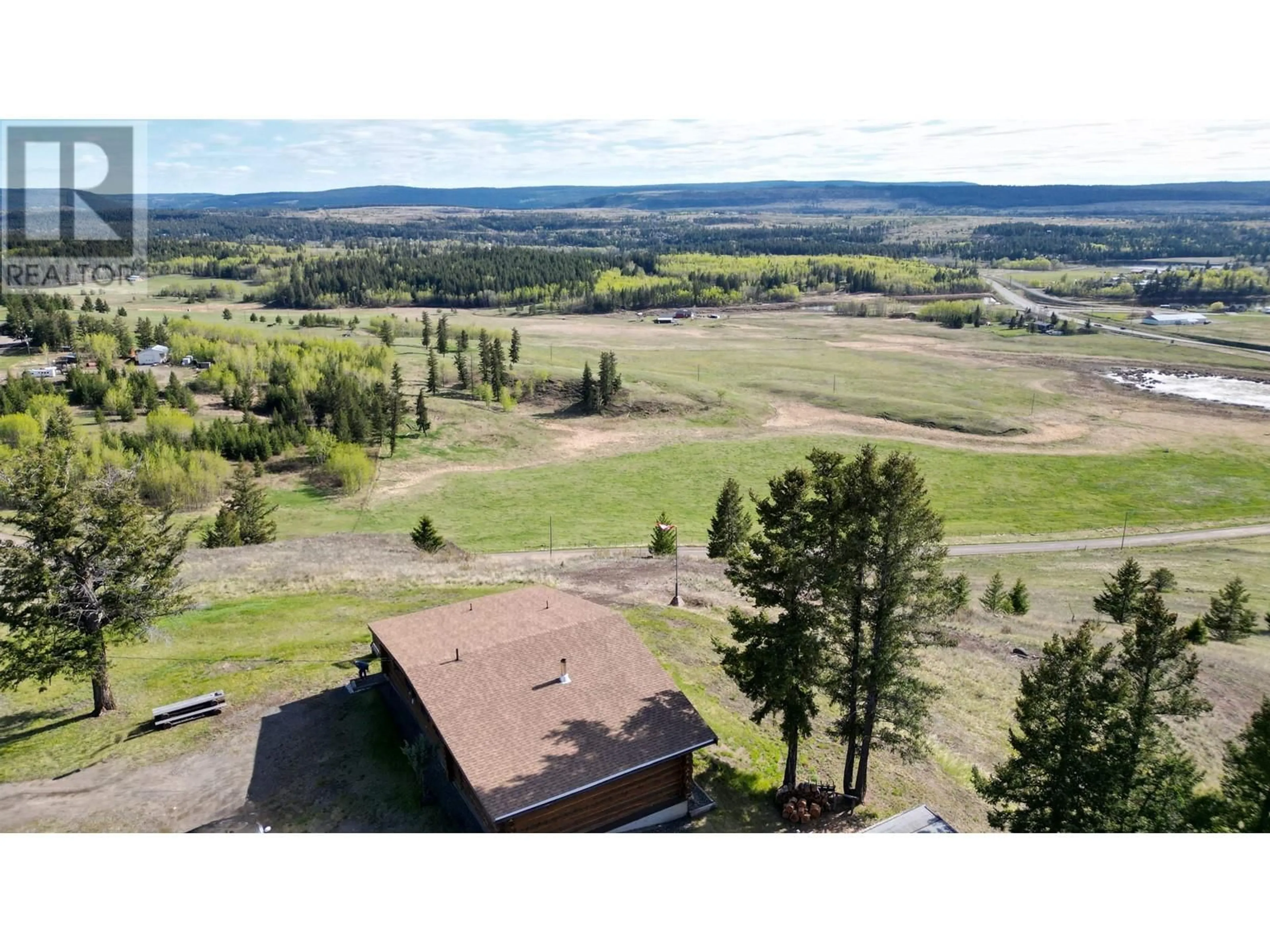 A pic from outside/outdoor area/front of a property/back of a property/a pic from drone, mountain view for 5549 BACKVALLEY ROAD, 100 Mile House British Columbia V0K2Z0