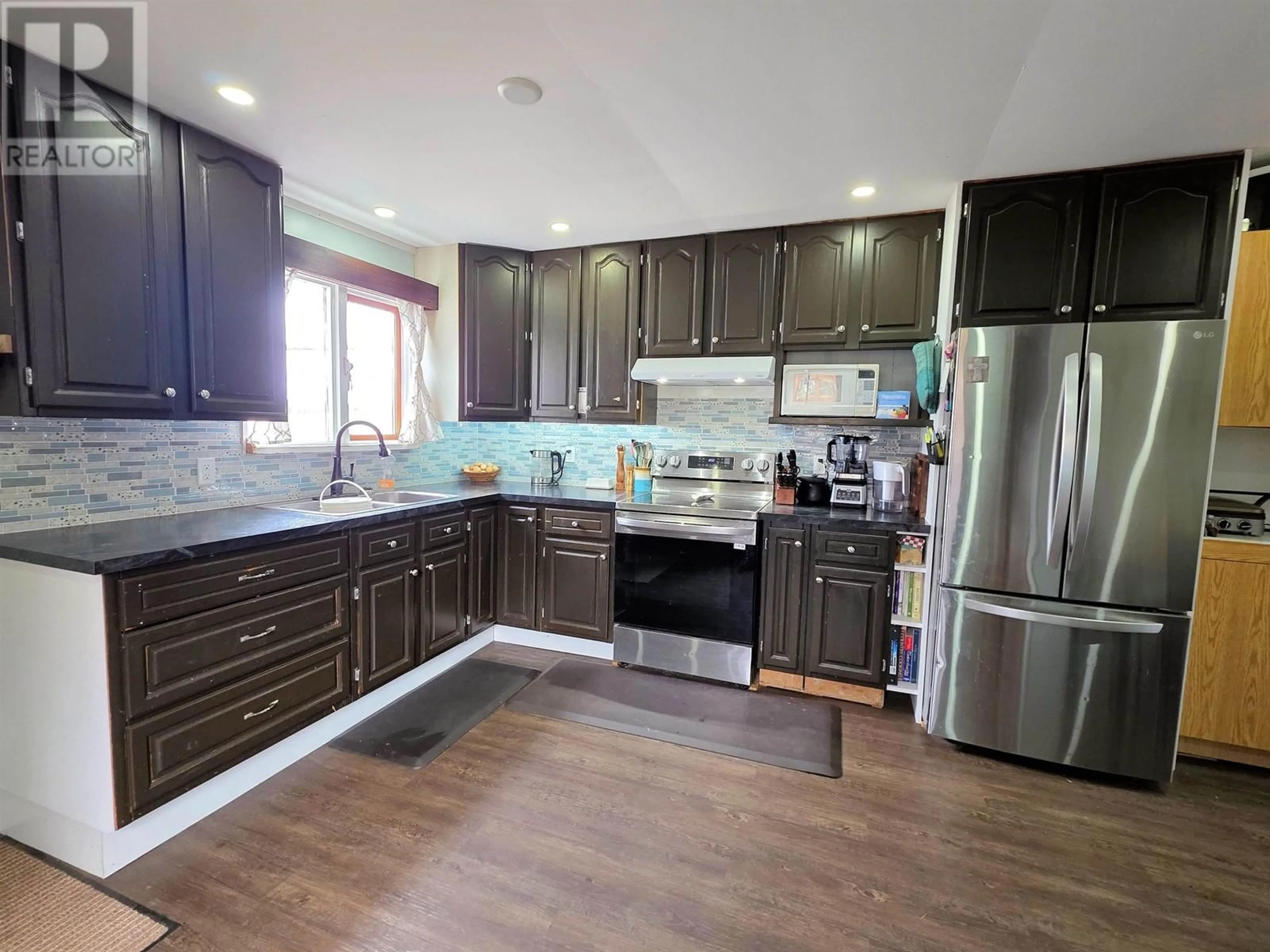 Open concept kitchen, wood/laminate floor for 19883 KERR ROAD, Telkwa British Columbia V0J2X2
