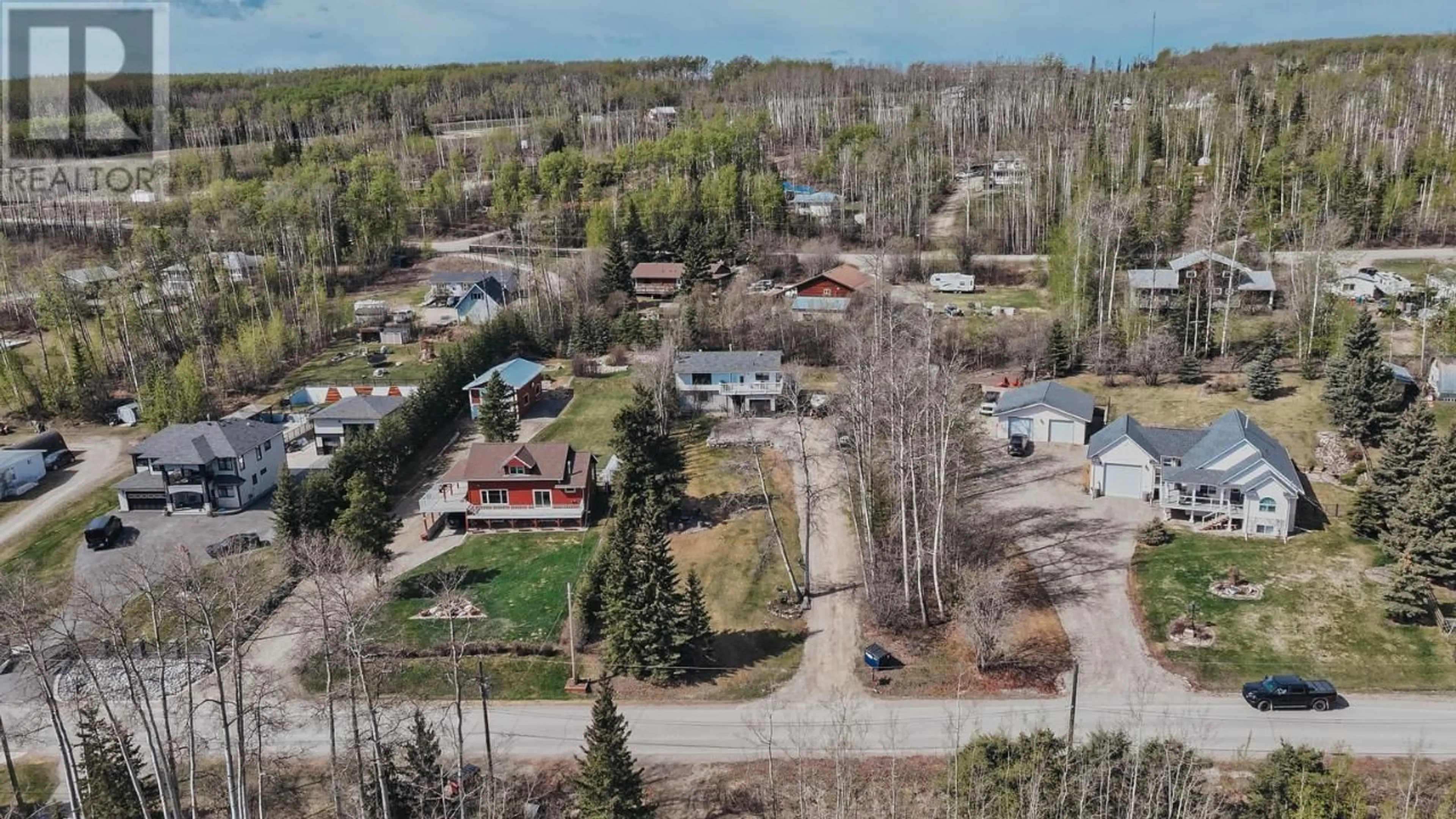 A pic from outside/outdoor area/front of a property/back of a property/a pic from drone, unknown for 13223 LAKESHORE DRIVE, Charlie Lake British Columbia V0C1H0
