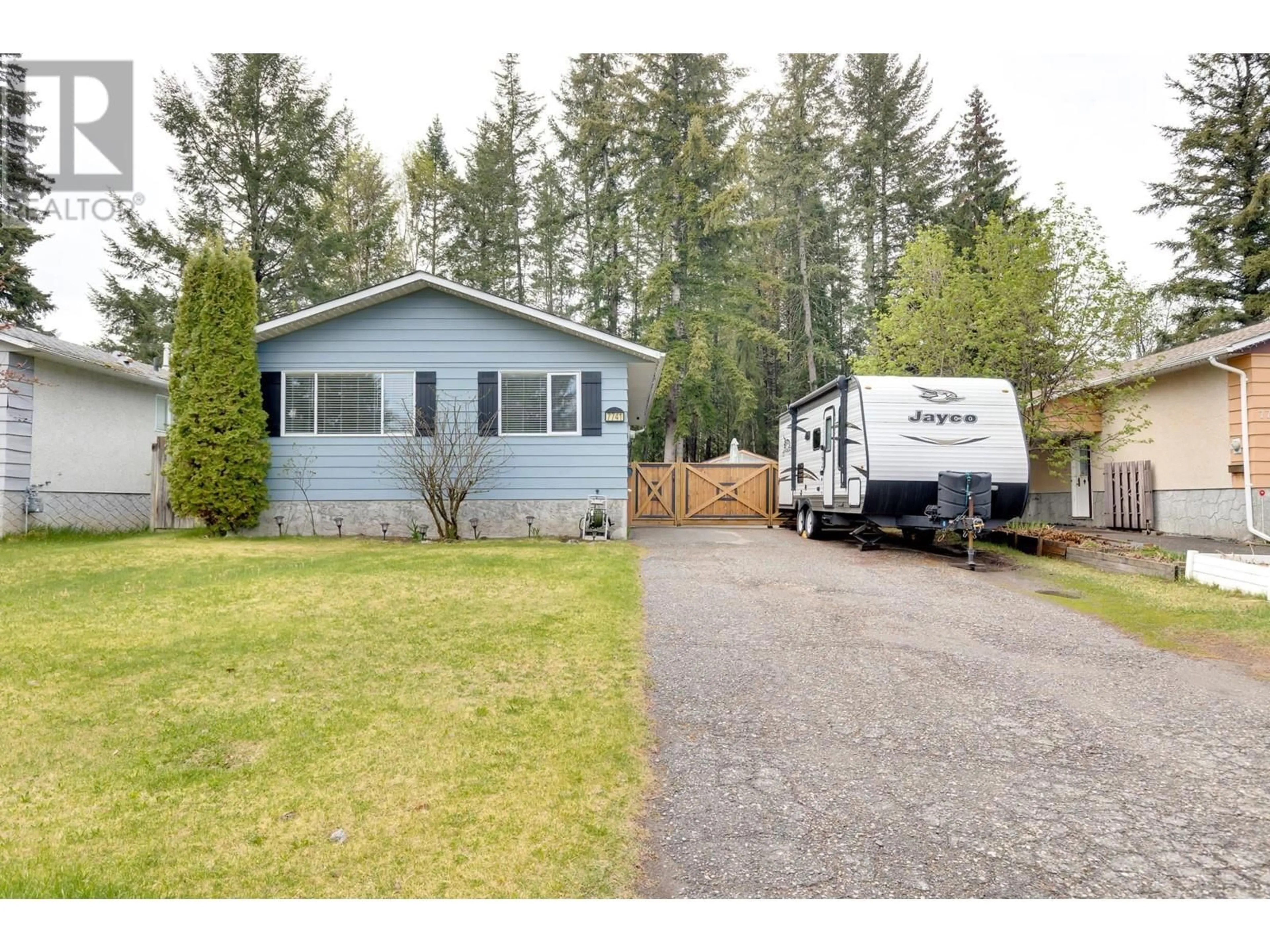 Home with vinyl exterior material, street for 7741 LANCASTER CRESCENT, Prince George British Columbia V2N3R2