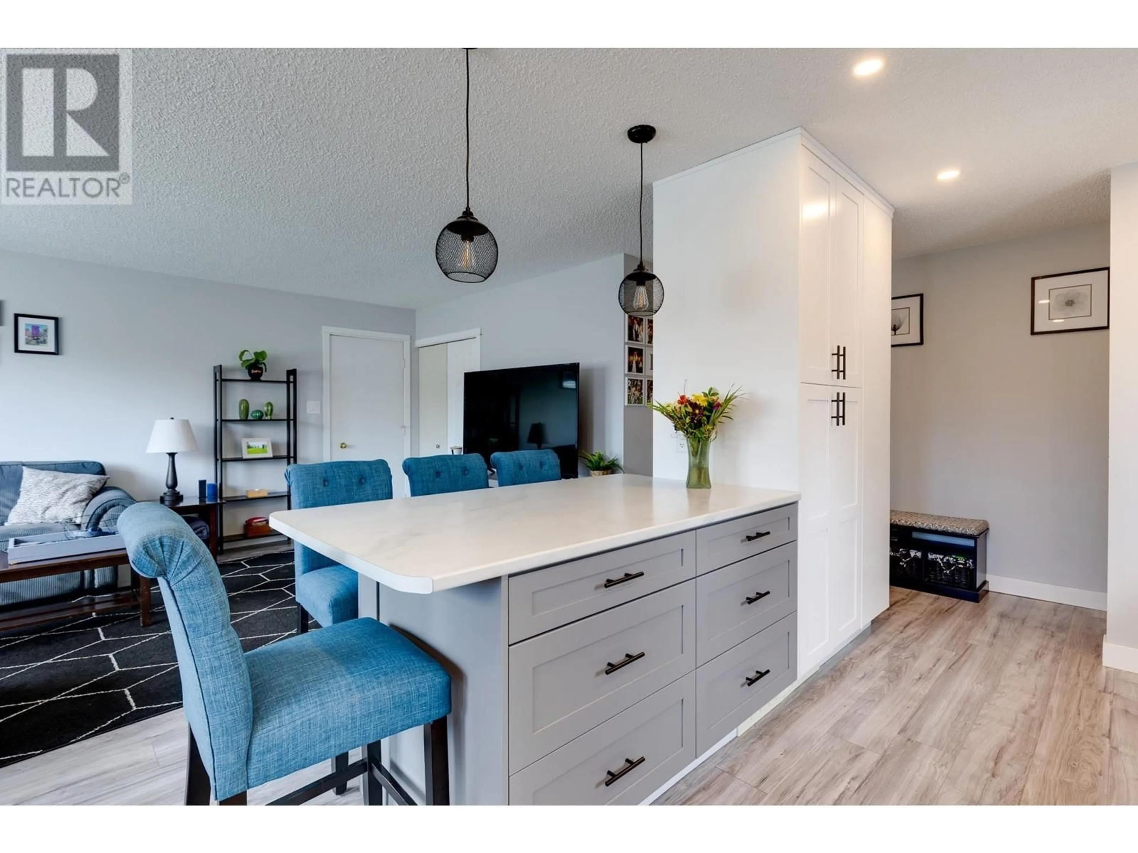 Open concept kitchen, wood/laminate floor for 7741 LANCASTER CRESCENT, Prince George British Columbia V2N3R2
