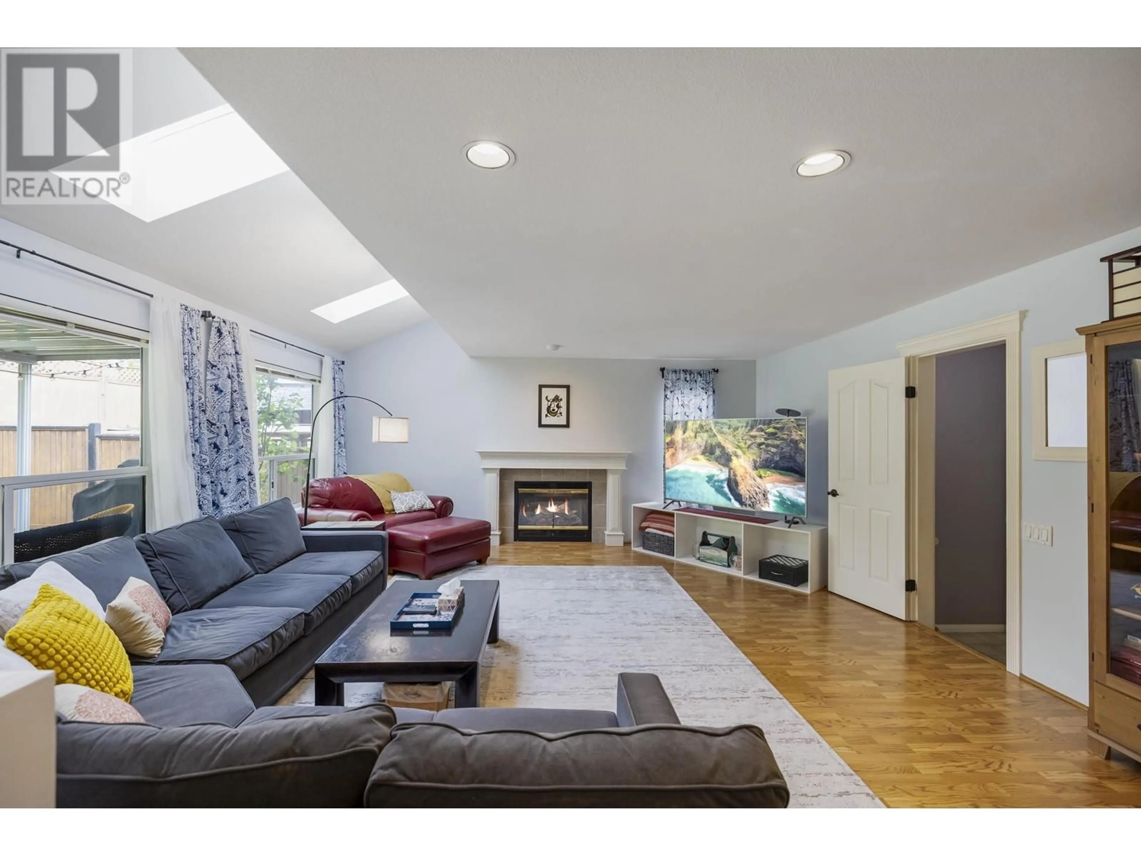 Living room with furniture, wood/laminate floor for 1167 SETTLERS COURT, Port Coquitlam British Columbia V3C5Y5