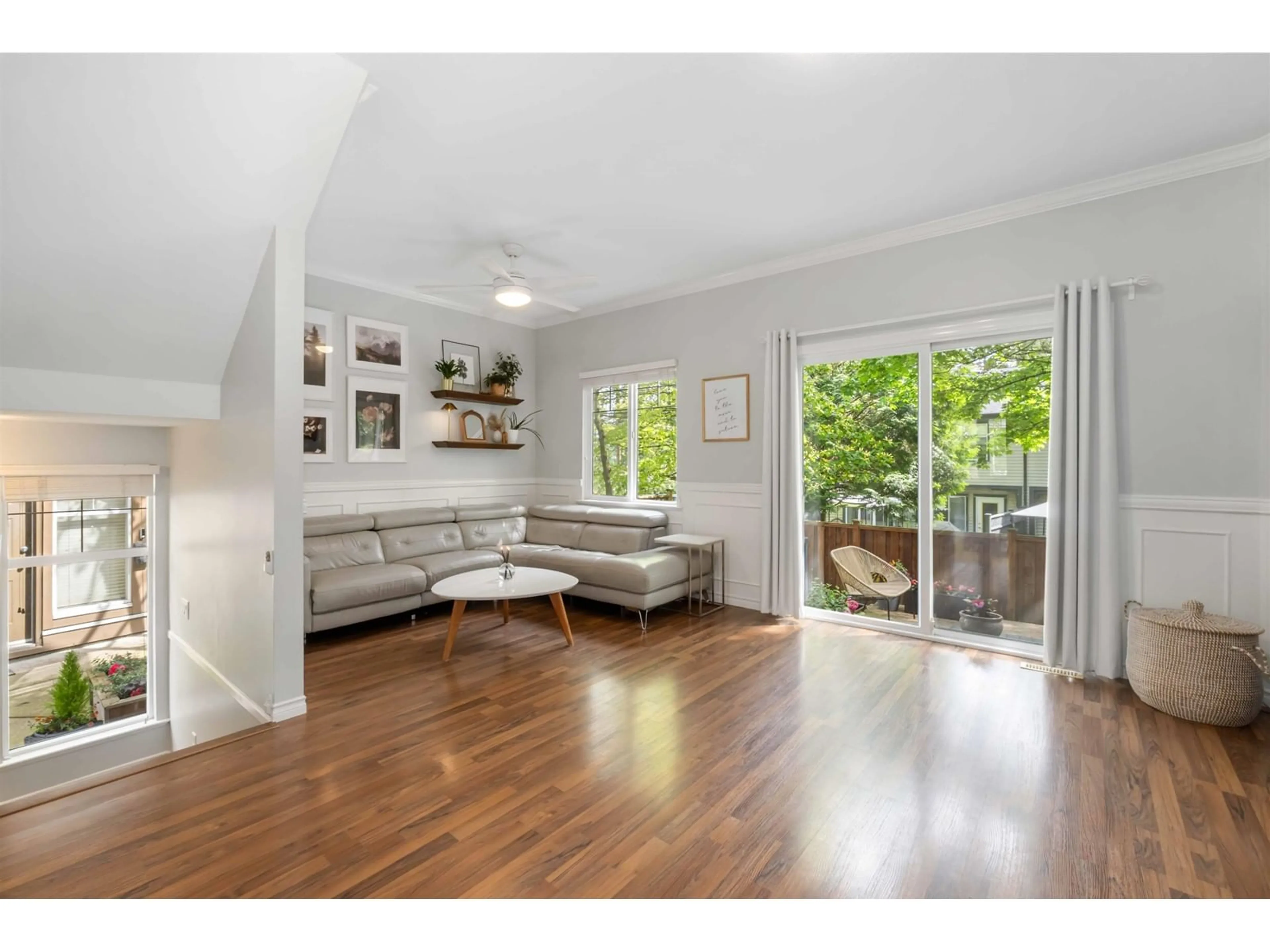 Living room with furniture, wood/laminate floor for 12 - 6588 188, Surrey British Columbia V3S1Z6