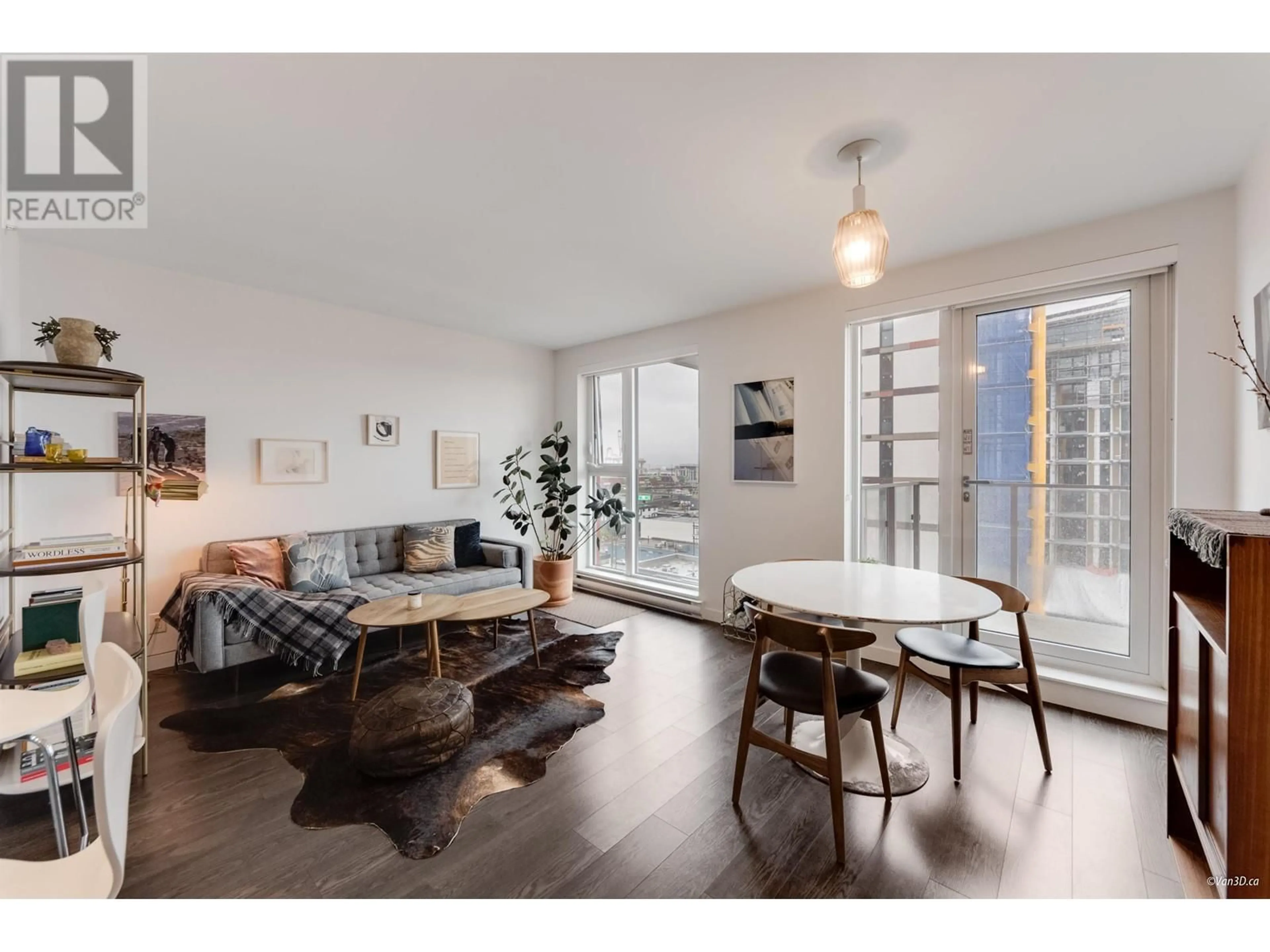 Living room with furniture, wood/laminate floor for 804 - 983 HASTINGS STREET, Vancouver British Columbia V6A0G9