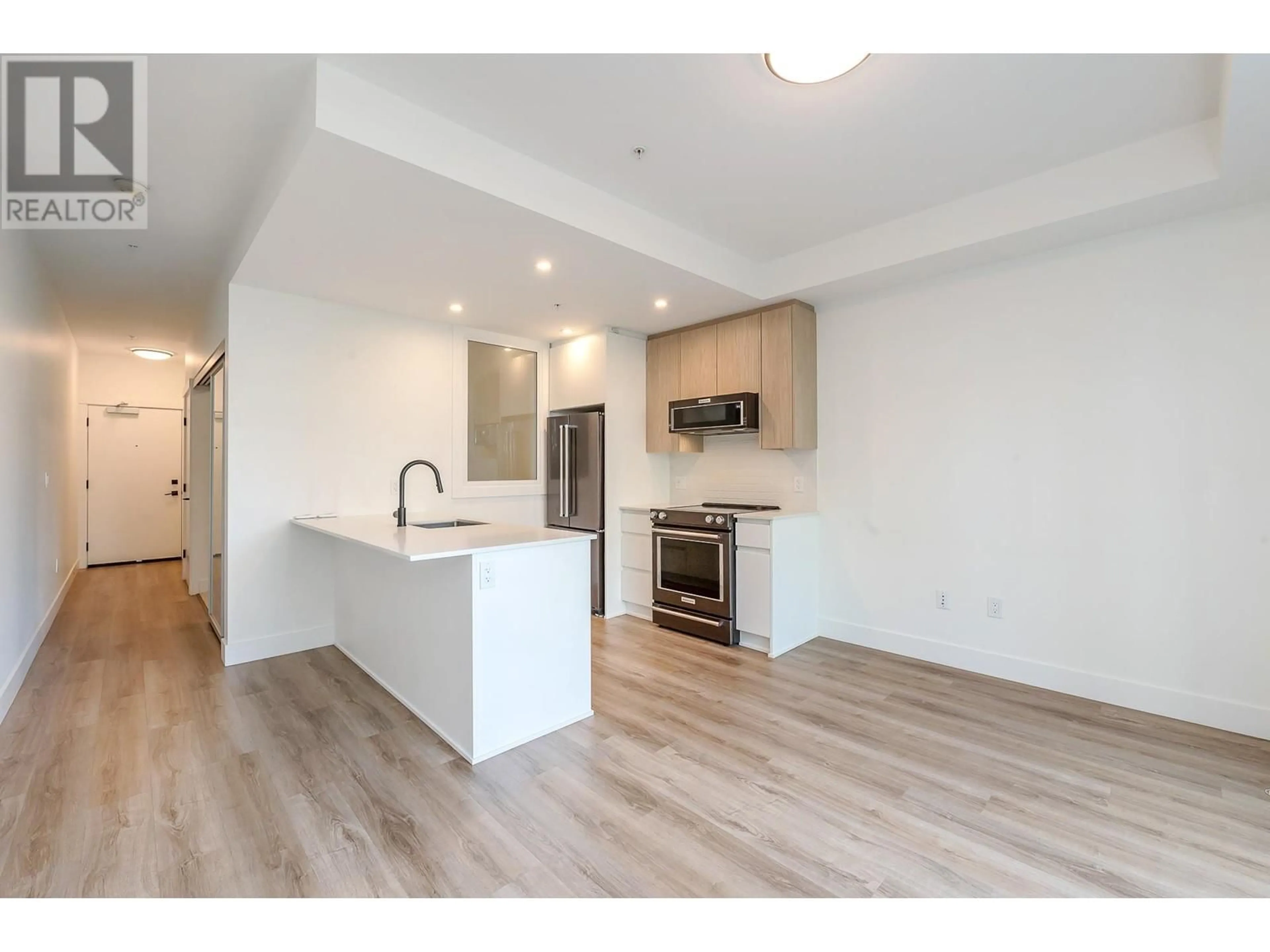 Open concept kitchen, wood/laminate floor for 1311 - 2180 KELLY AVENUE, Port Coquitlam British Columbia V3C0S6
