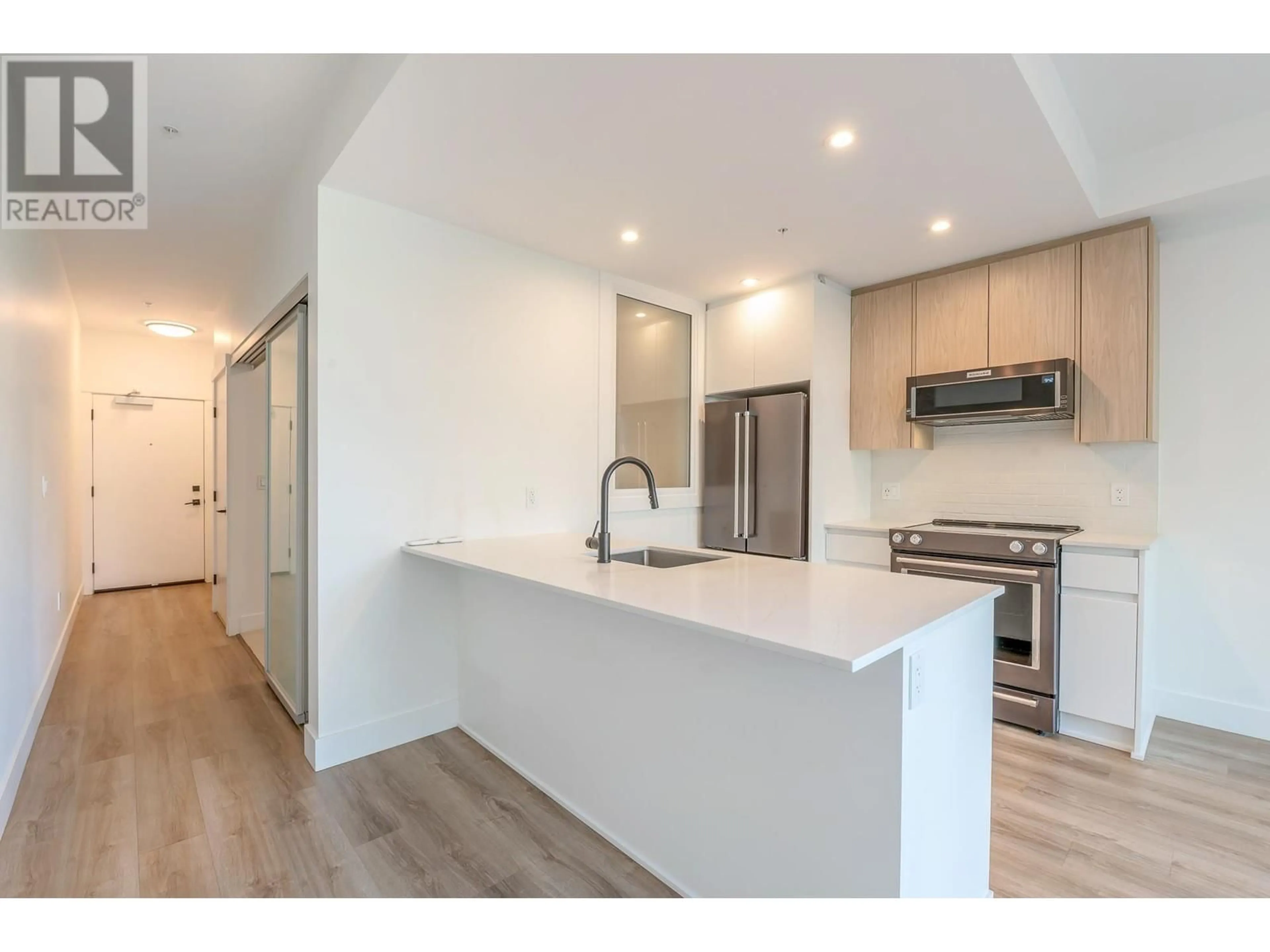 Open concept kitchen, wood/laminate floor for 1311 - 2180 KELLY AVENUE, Port Coquitlam British Columbia V3C0S6