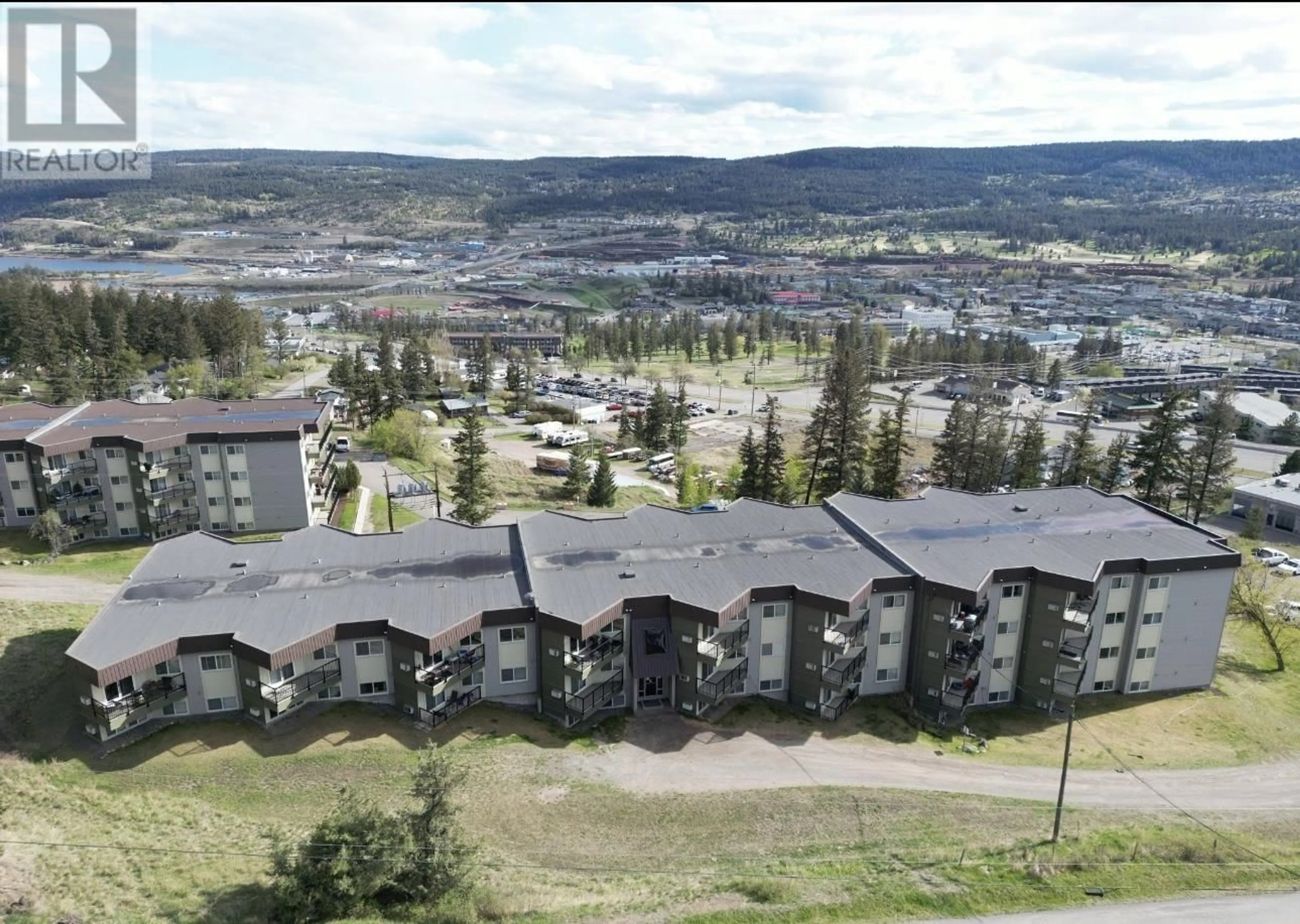 A pic from outside/outdoor area/front of a property/back of a property/a pic from drone, mountain view for 405 - 282 BROADWAY AVENUE, Williams Lake British Columbia V2G4J8
