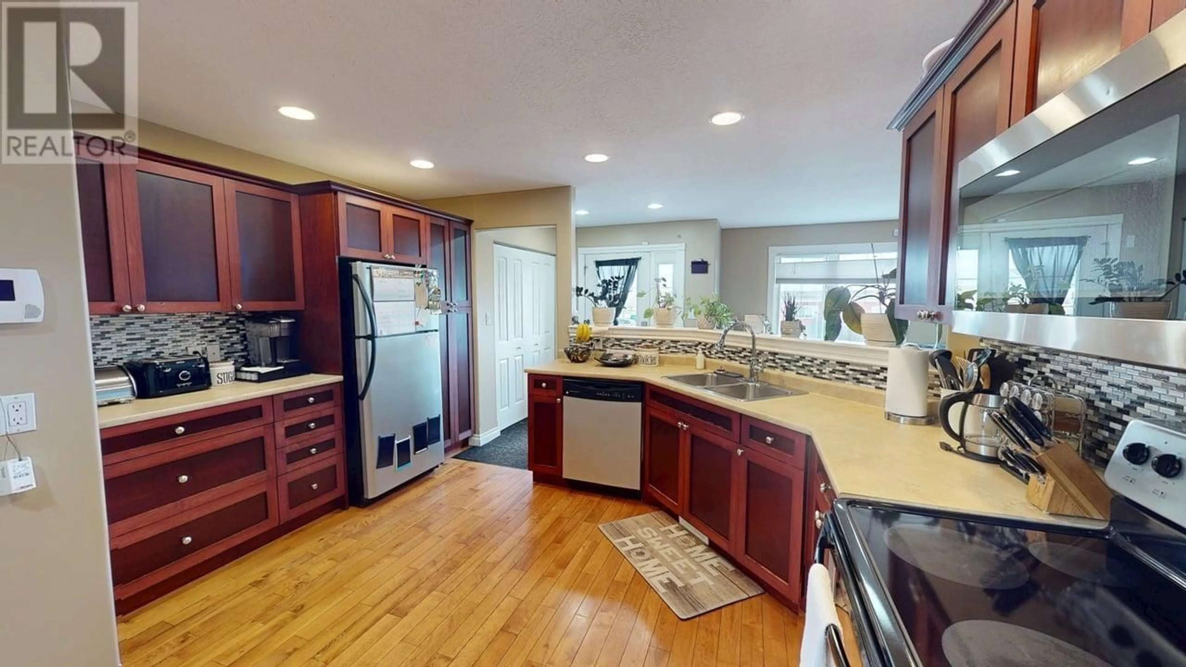 Open concept kitchen, ceramic/tile floor for 8508 82 STREET, Fort St. John British Columbia V1J0H1