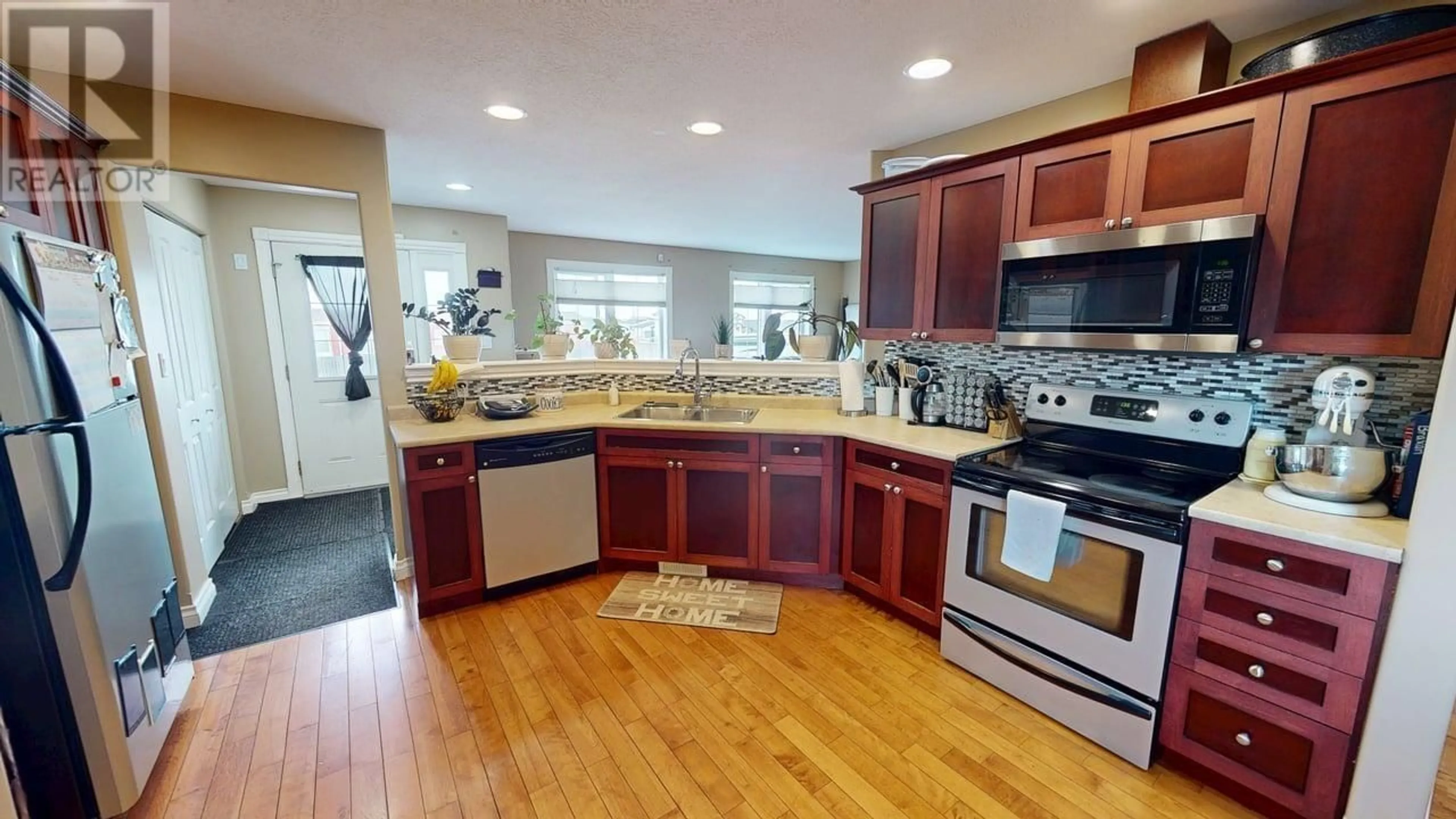 Open concept kitchen, ceramic/tile floor for 8508 82 STREET, Fort St. John British Columbia V1J0H1