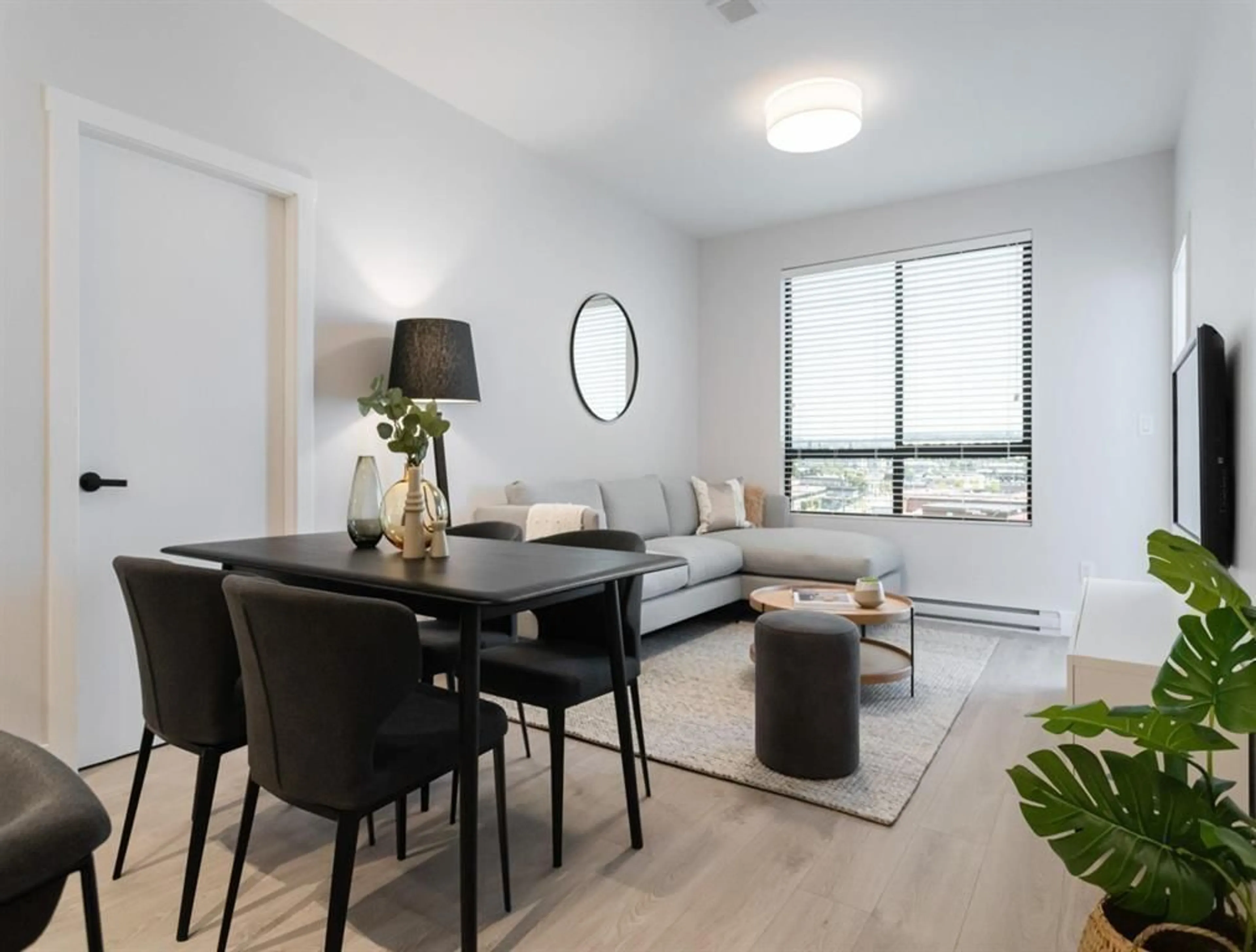 Living room with furniture, wood/laminate floor for 103 - 13458 95, Surrey British Columbia V3R7W4