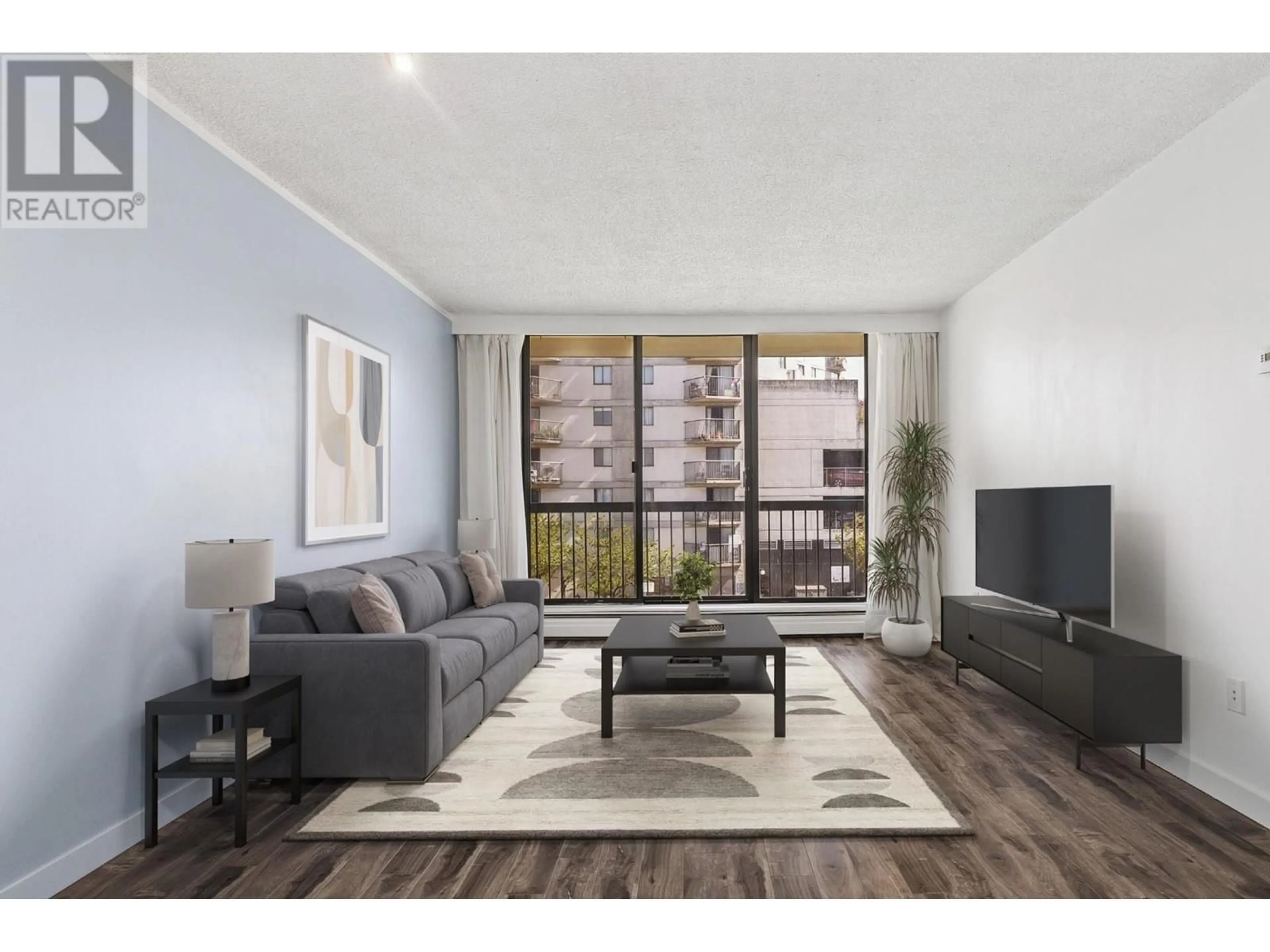 Living room with furniture, wood/laminate floor for 304 - 145 ST. GEORGES AVENUE, North Vancouver British Columbia V7L3G8