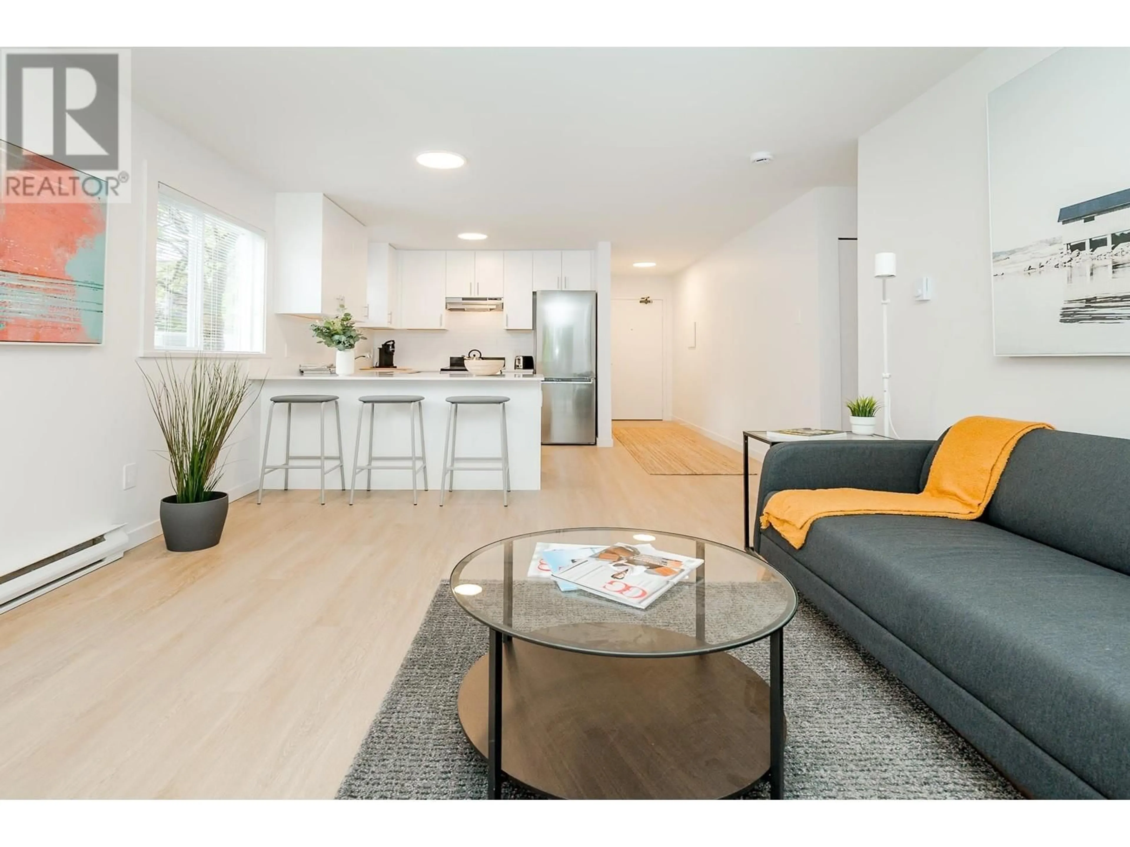 Living room with furniture, wood/laminate floor for 304 - 8690 MONTCALM STREET, Vancouver British Columbia V6P4P8