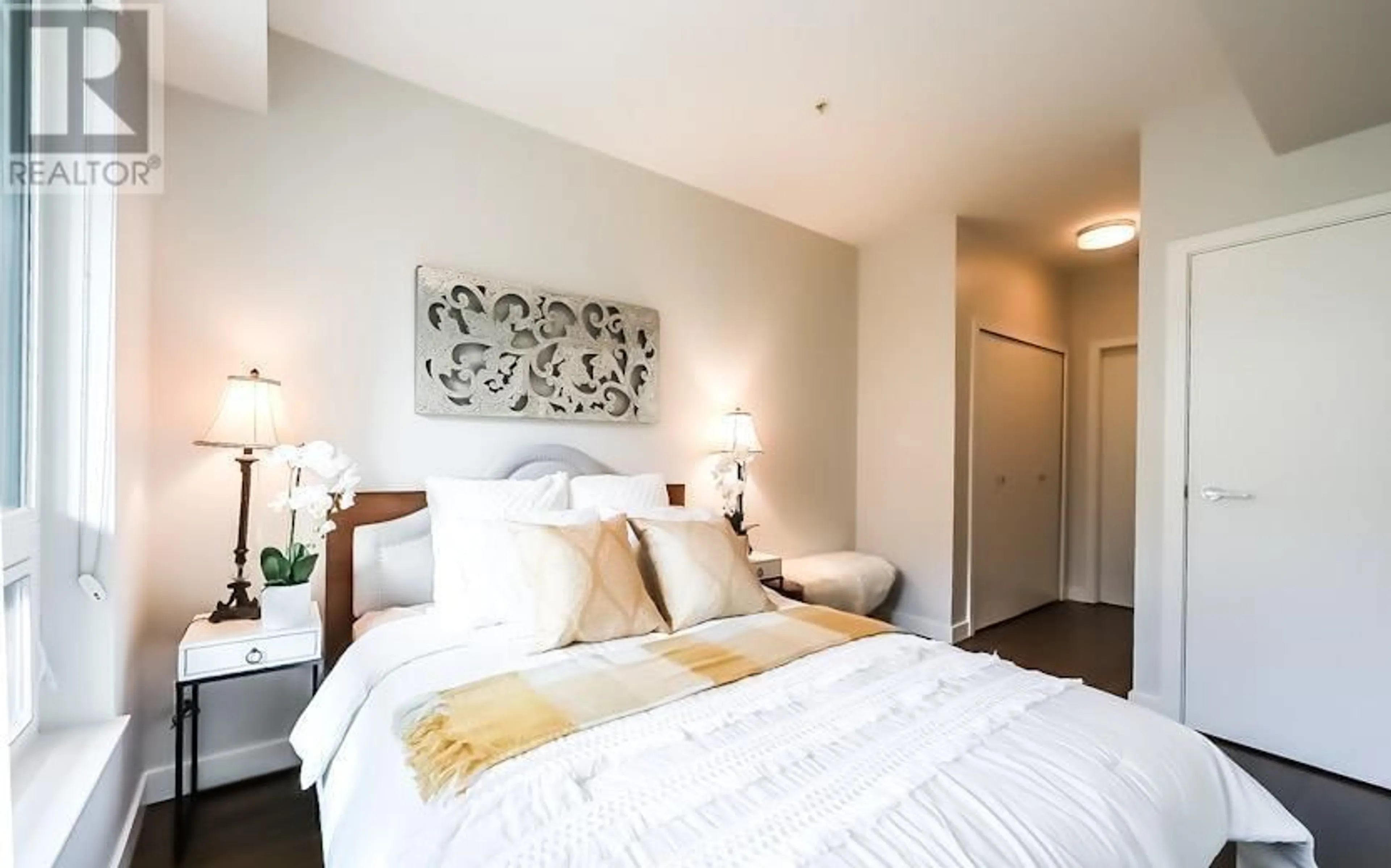 Bedroom with bed, wood/laminate floor for 228 - 9388 ODLIN ROAD, Richmond British Columbia V6X0L5