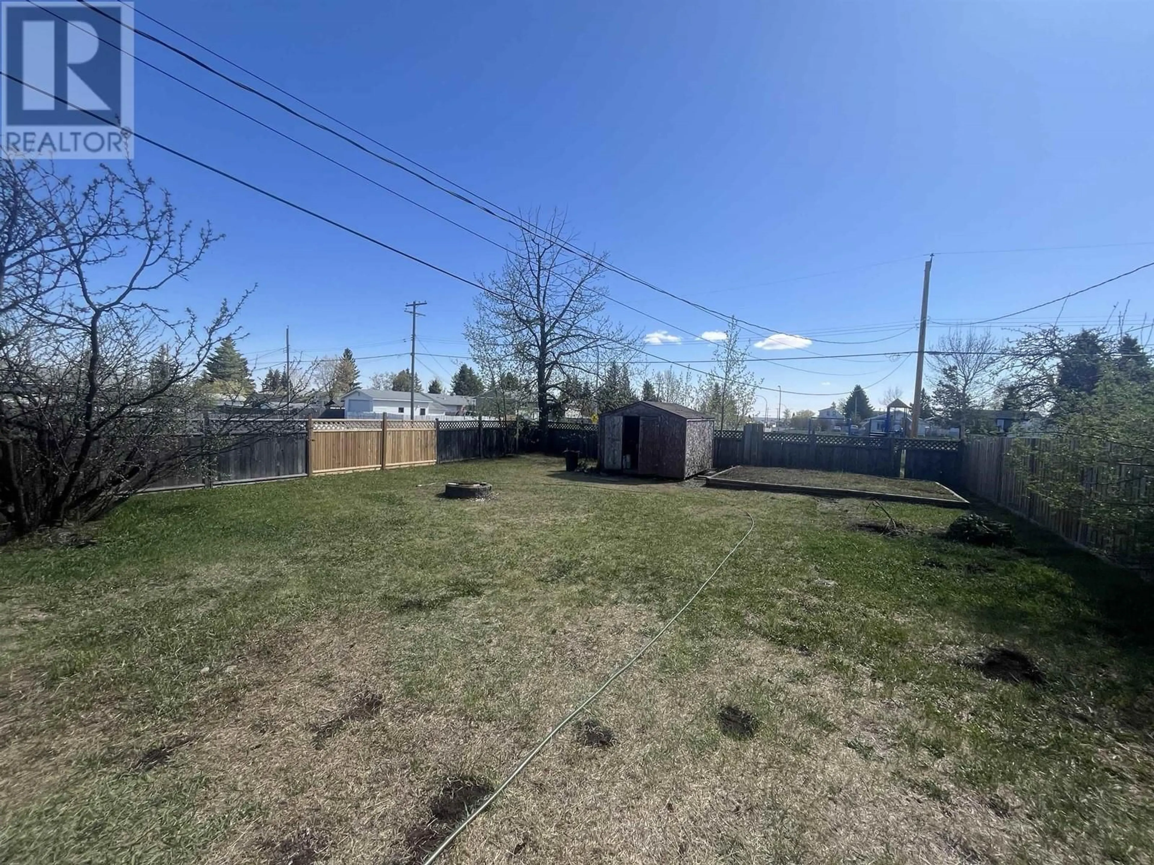 A pic from outside/outdoor area/front of a property/back of a property/a pic from drone, unknown for 8203 96 AVENUE, Fort St. John British Columbia V1J1J7