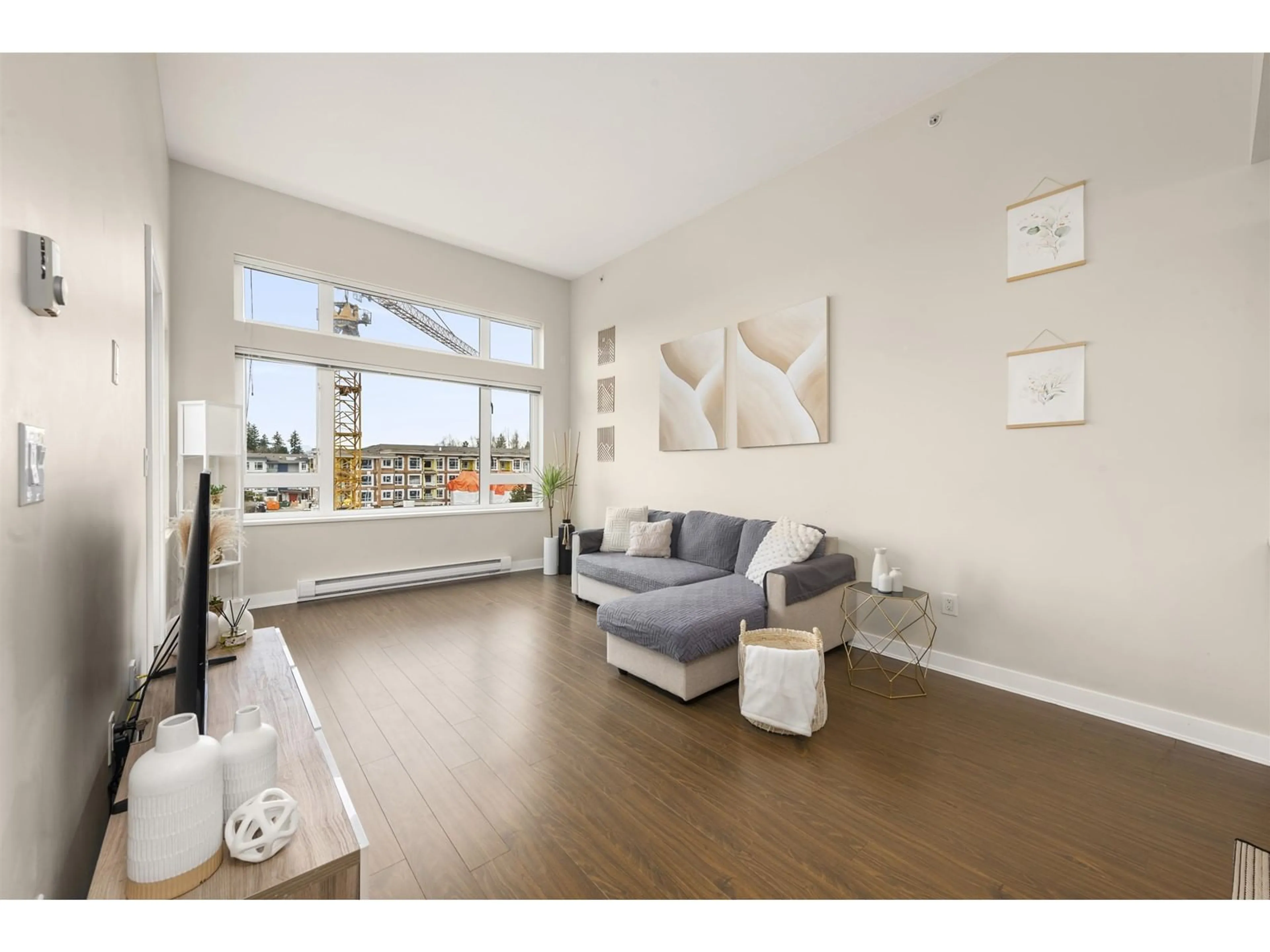 Living room with furniture, wood/laminate floor for 408 - 13740 75A, Surrey British Columbia V3W0E8