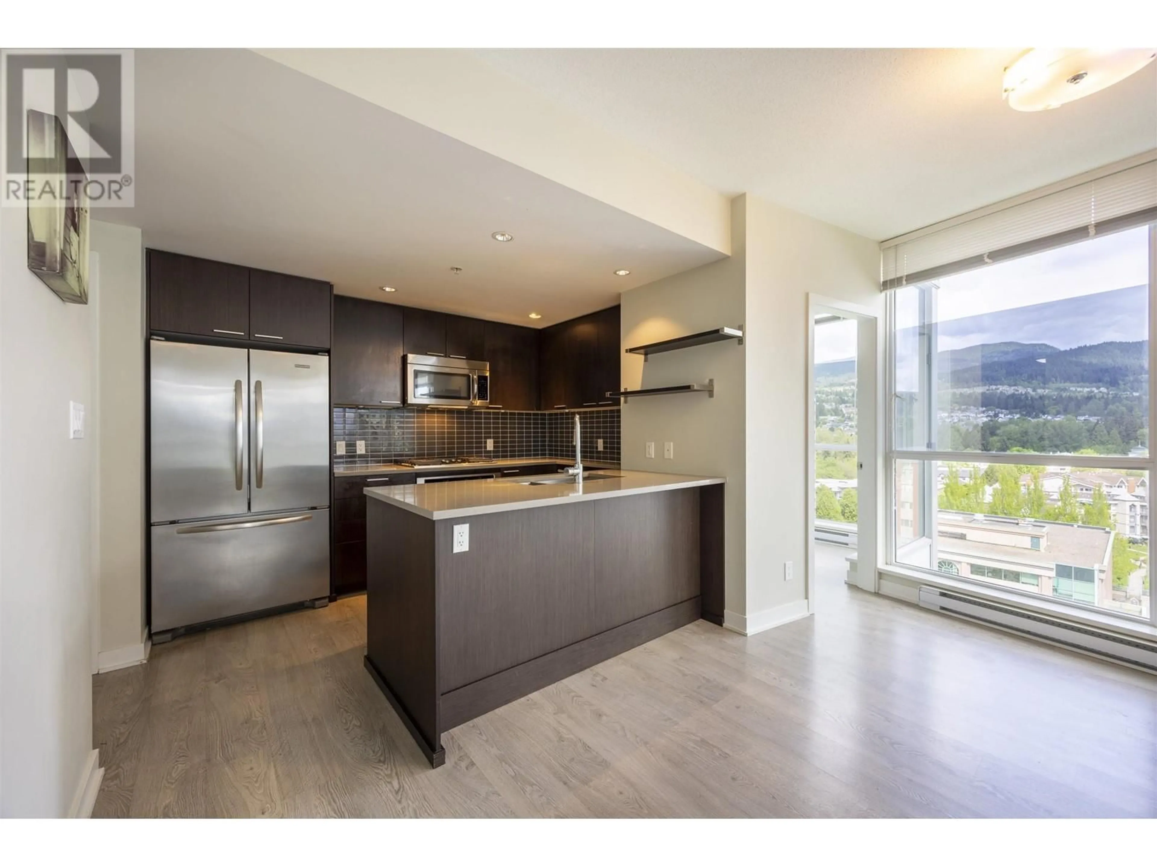 Open concept kitchen, ceramic/tile floor for 1602 - 2975 ATLANTIC AVENUE, Coquitlam British Columbia V3B0C5
