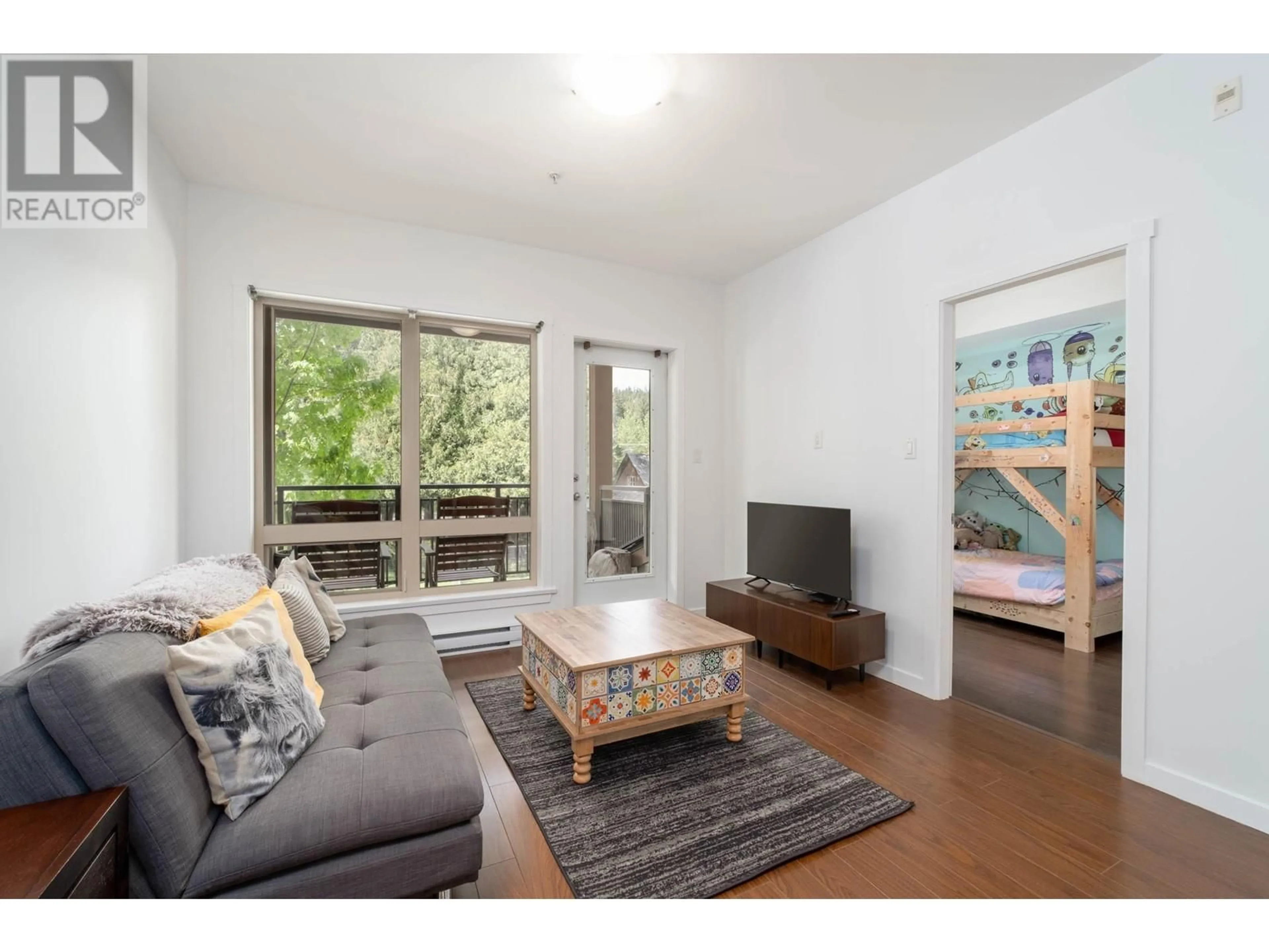Living room with furniture, wood/laminate floor for 2 - 7450 PROSPECT STREET, Pemberton British Columbia V0N2L1