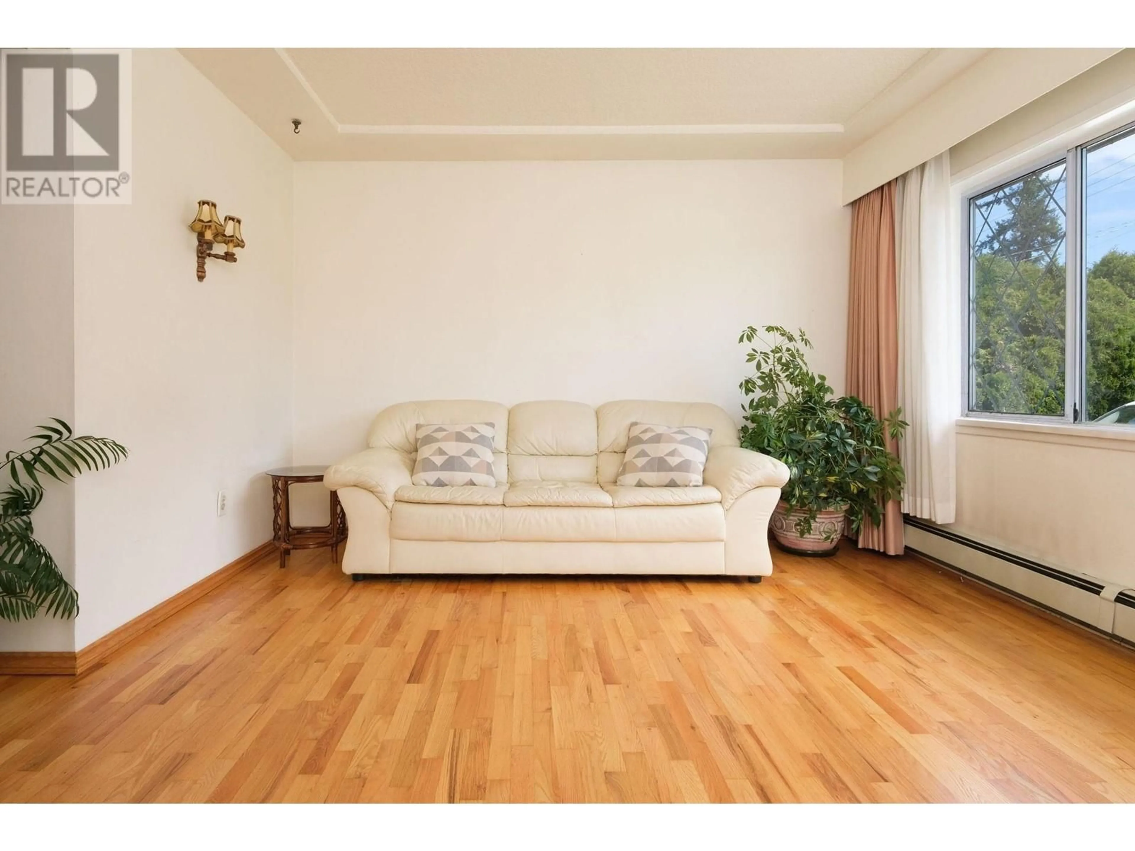 Living room with furniture, wood/laminate floor for 8481 13TH AVENUE, Burnaby British Columbia V3N2H1