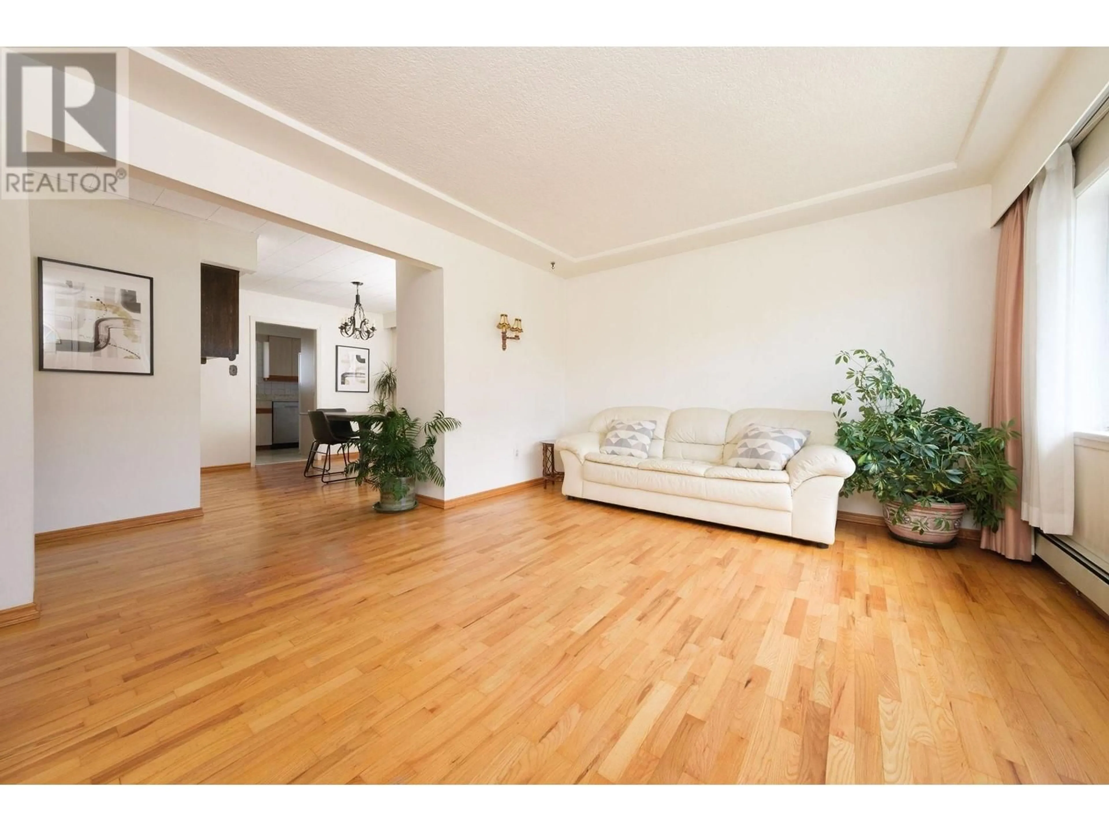 Living room with furniture, wood/laminate floor for 8481 13TH AVENUE, Burnaby British Columbia V3N2H1