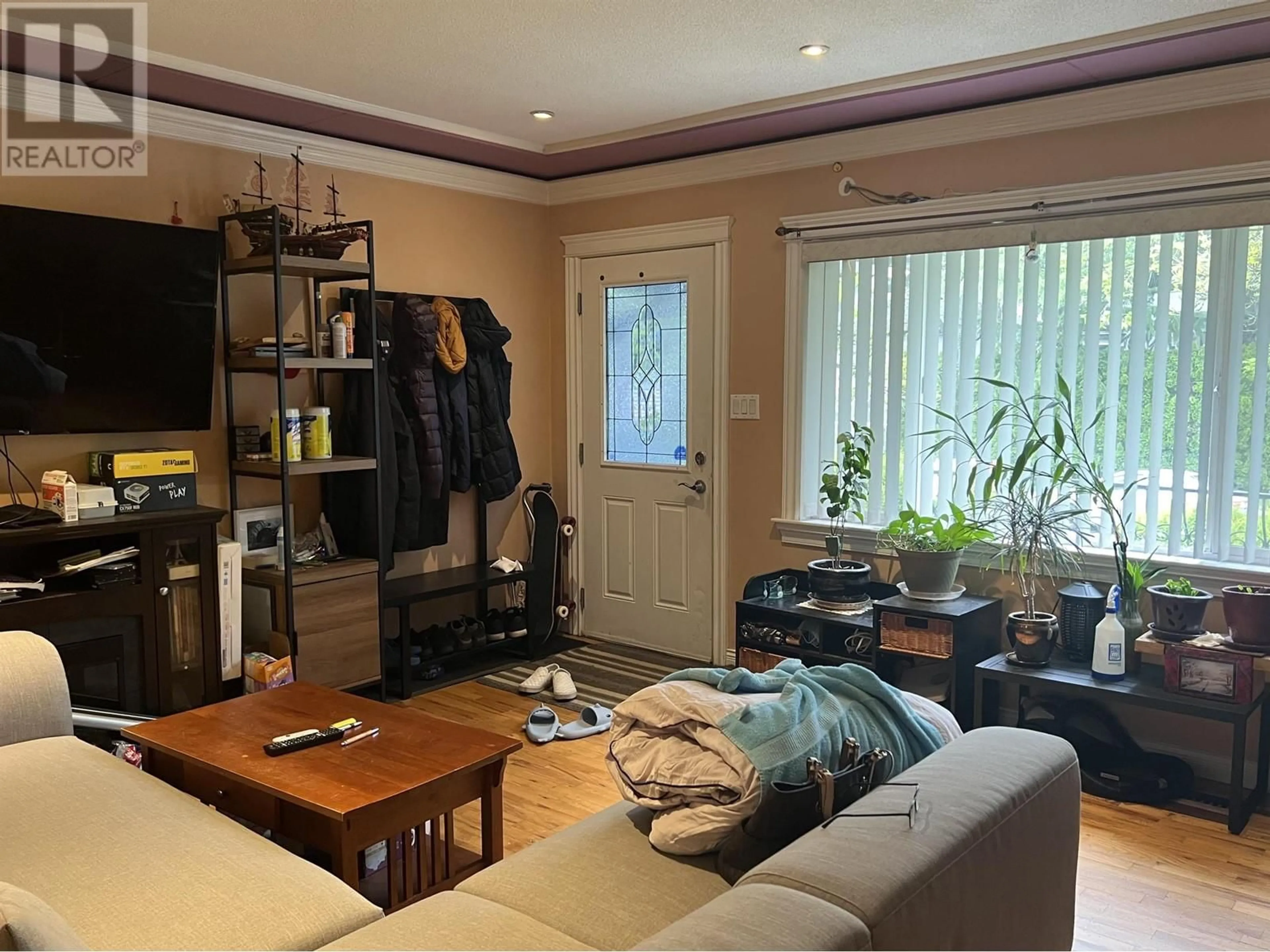 Living room with furniture, wood/laminate floor for 3438 NAPIER STREET, Vancouver British Columbia V5K2X6