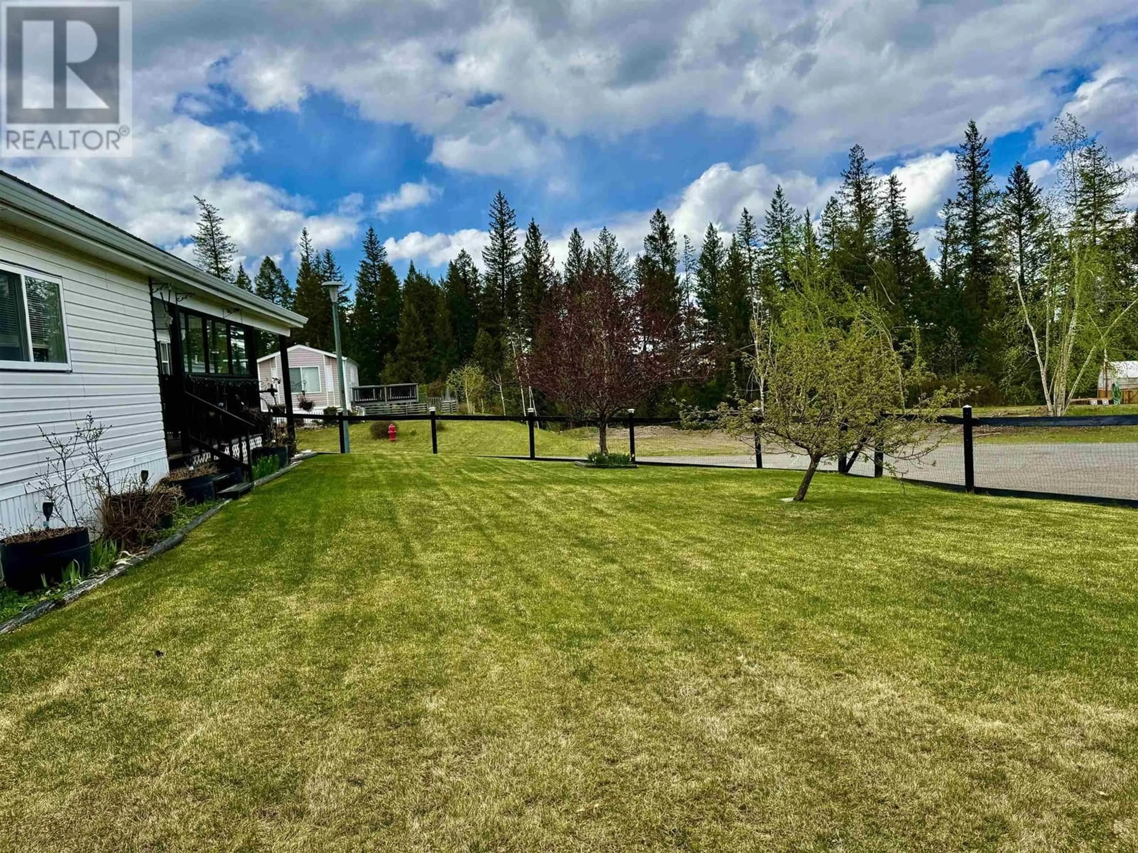 A pic from outside/outdoor area/front of a property/back of a property/a pic from drone, unknown for 21 - 208 8TH STREET, 100 Mile House British Columbia V0K2E0