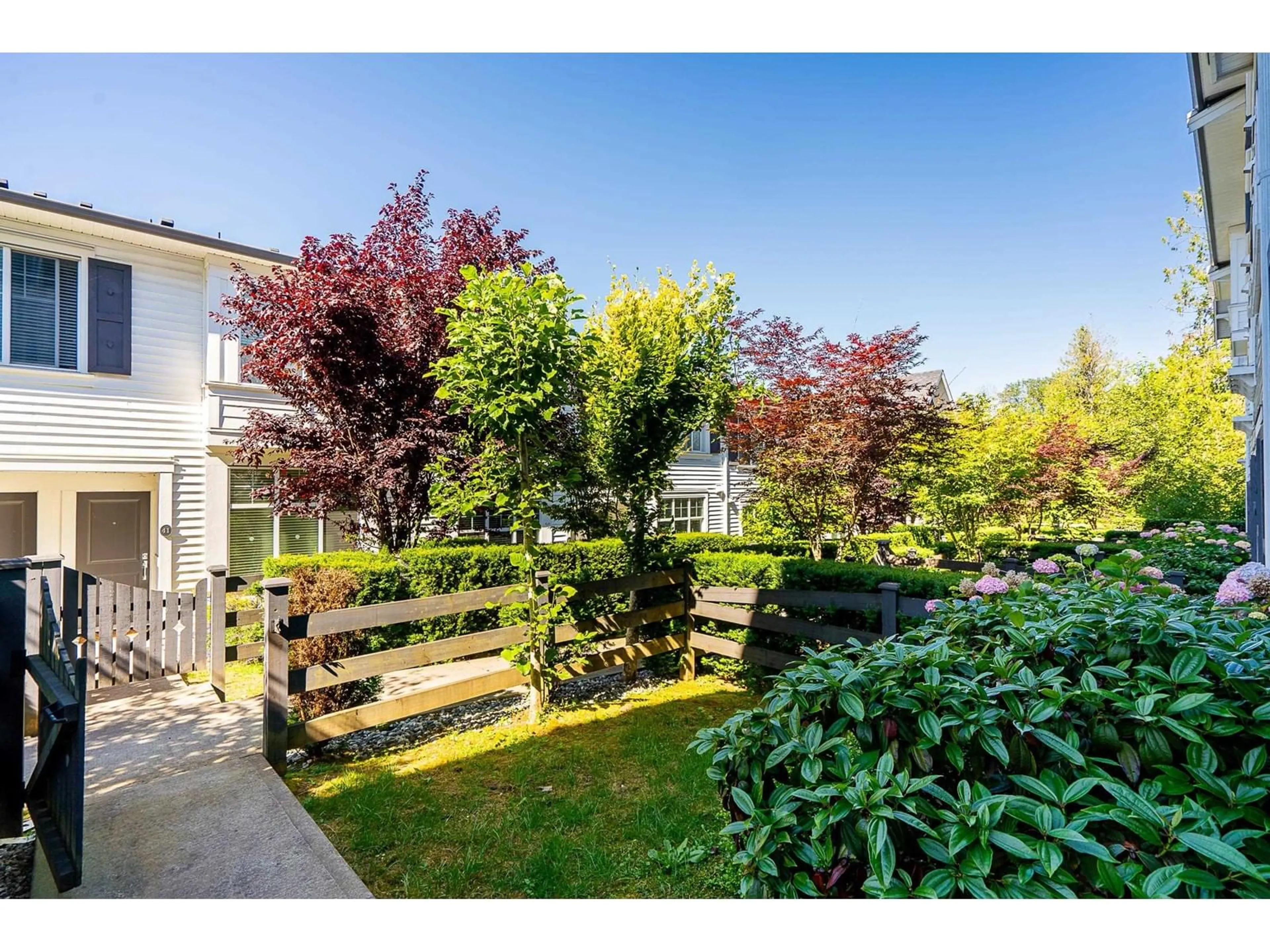 A pic from outside/outdoor area/front of a property/back of a property/a pic from drone, street for 94 - 8130 136A, Surrey British Columbia V3W1H9