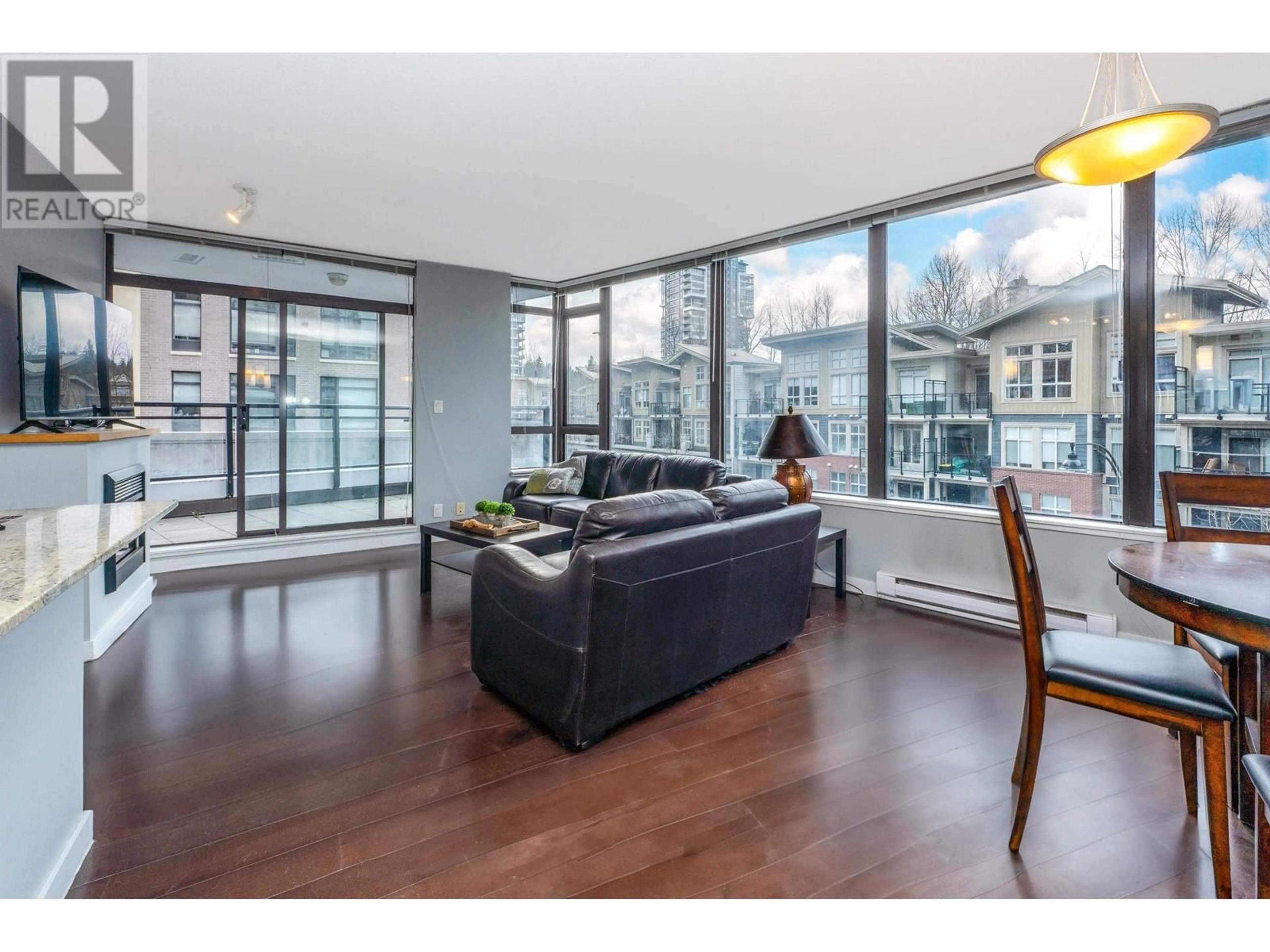 Living room with furniture, wood/laminate floor for 204 - 110 BREW STREET, Port Moody British Columbia V3H0E4