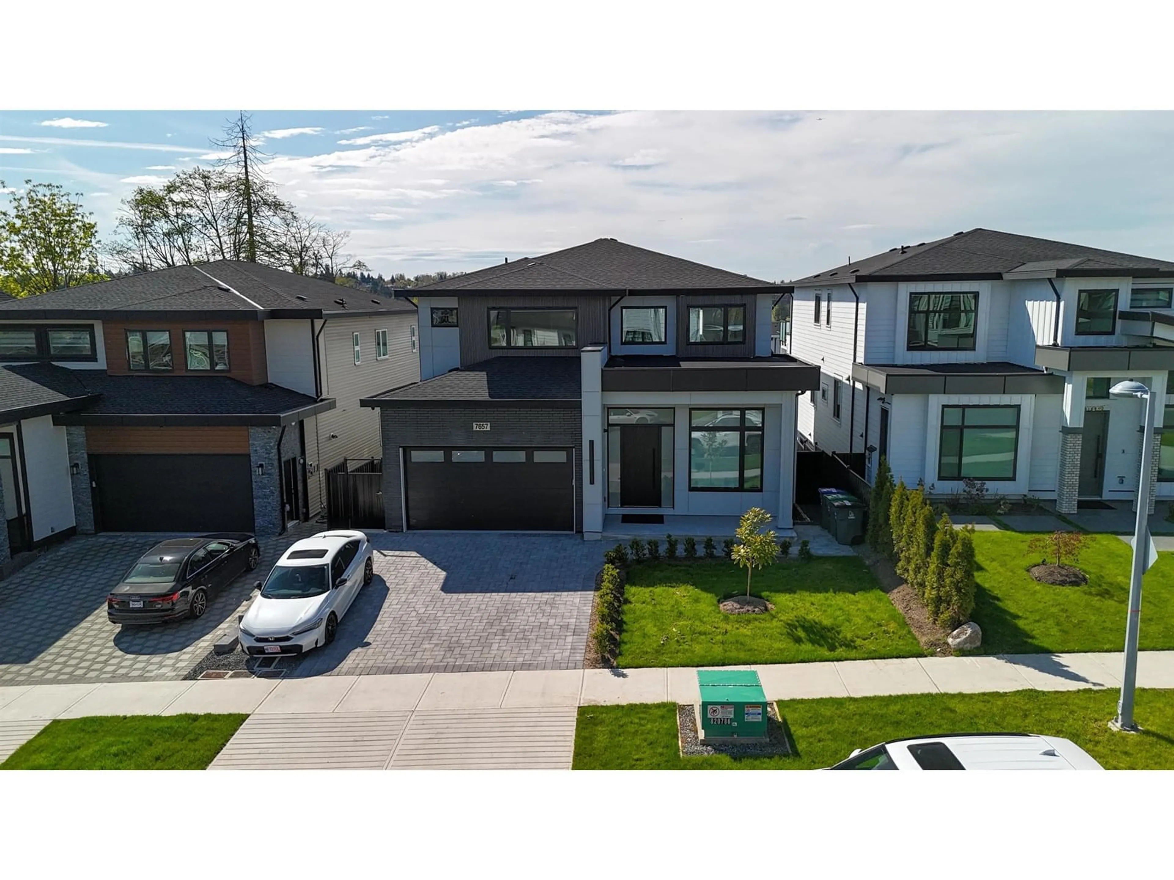 A pic from outside/outdoor area/front of a property/back of a property/a pic from drone, street for 7657 155, Surrey British Columbia V3S3P3
