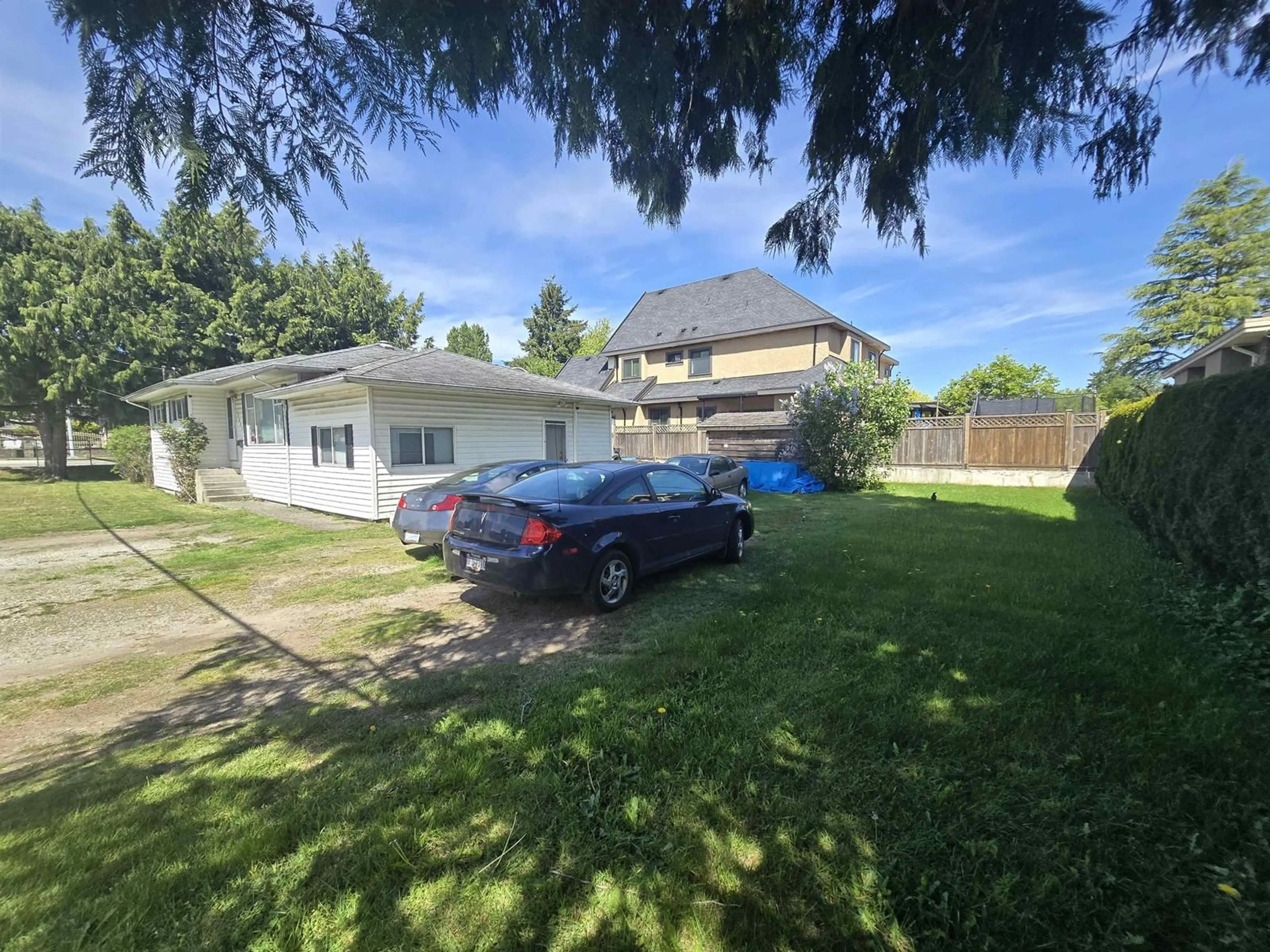 A pic from outside/outdoor area/front of a property/back of a property/a pic from drone, street for 12411 78, Surrey British Columbia V3W2X5