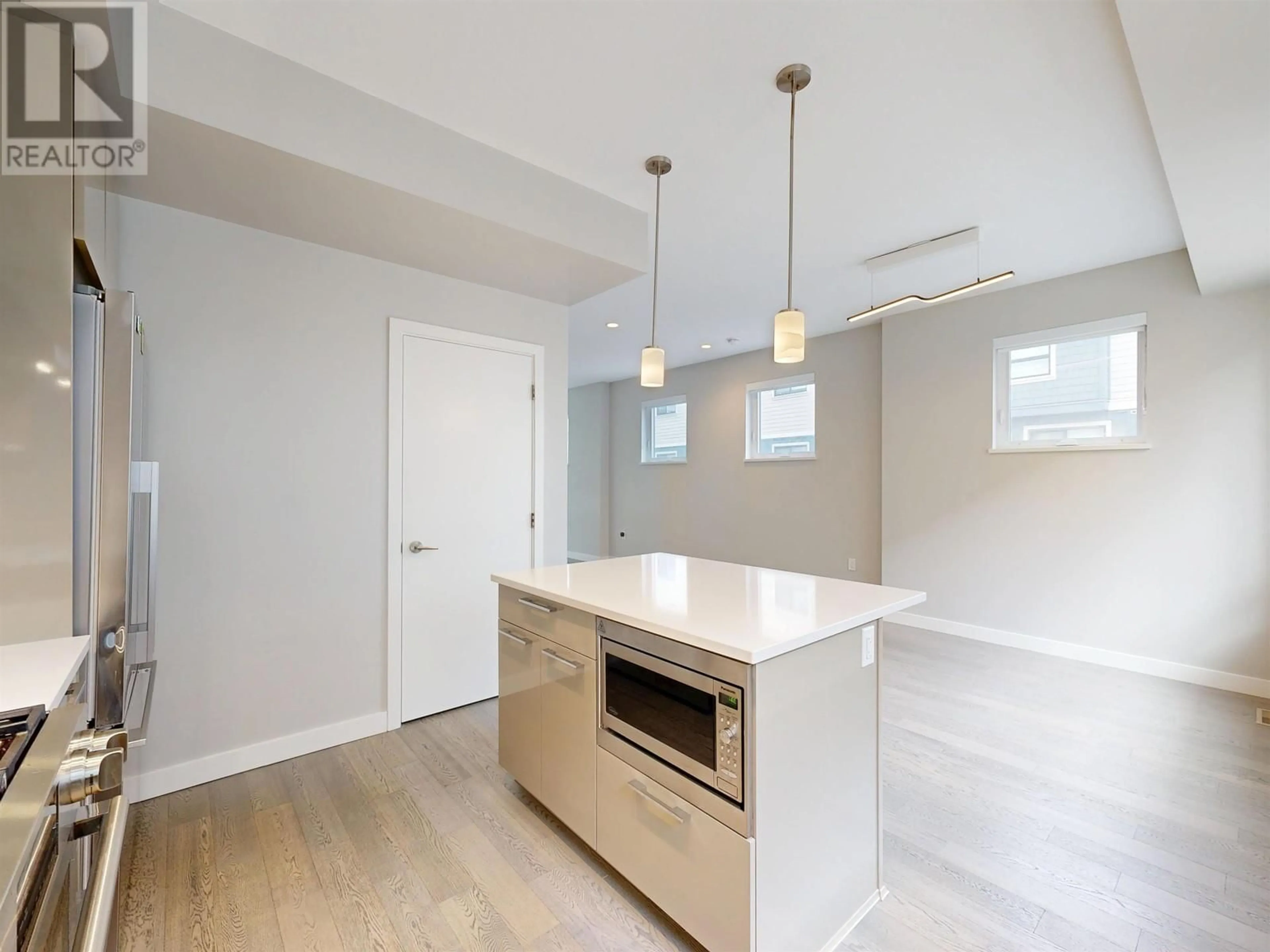 Open concept kitchen, wood/laminate floor for 18 - 10233 RIVER DRIVE, Richmond British Columbia V6X0T7