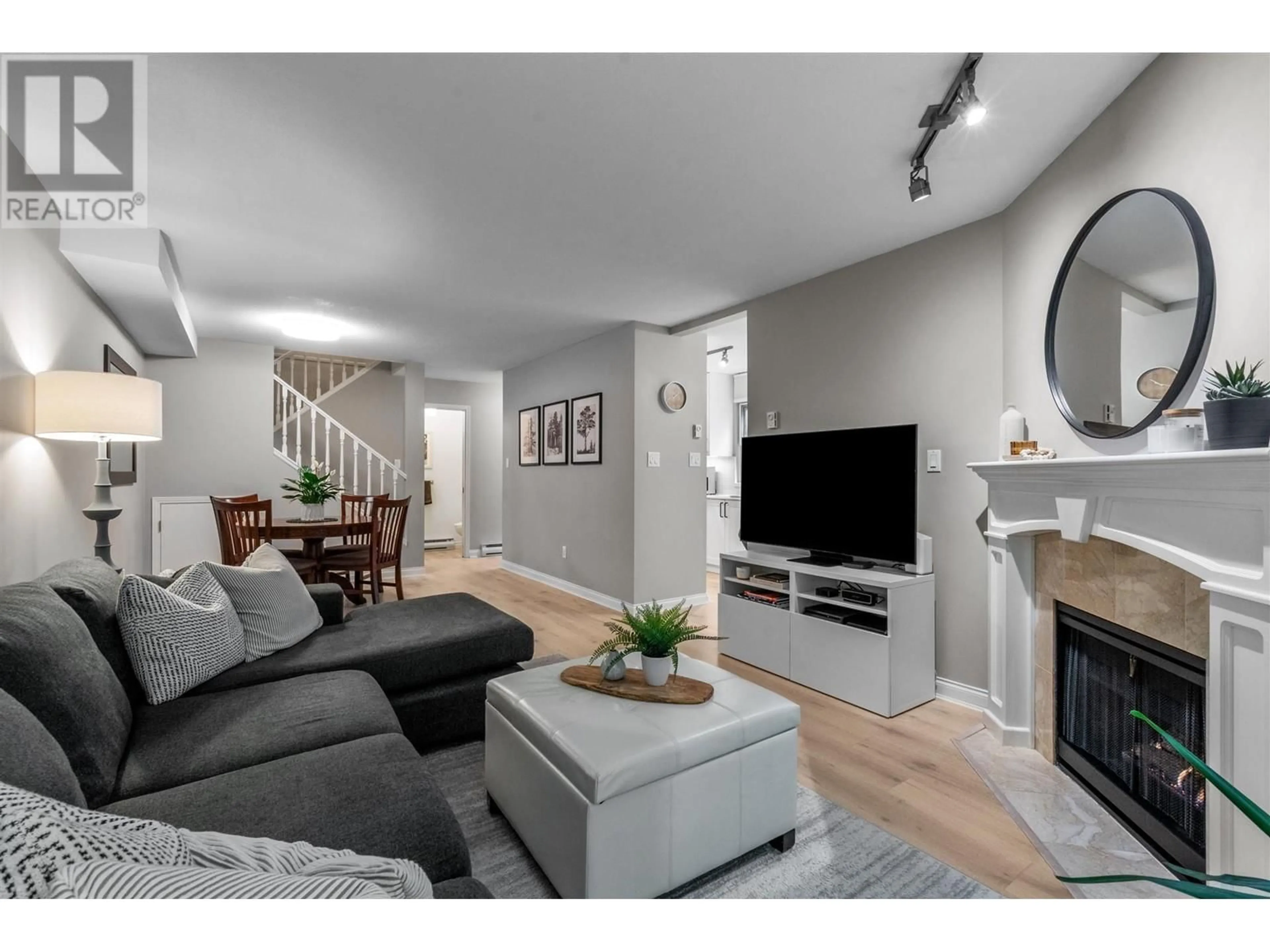 Living room with furniture, wood/laminate floor for 5 - 65 FOXWOOD DRIVE, Port Moody British Columbia V3H4Z5