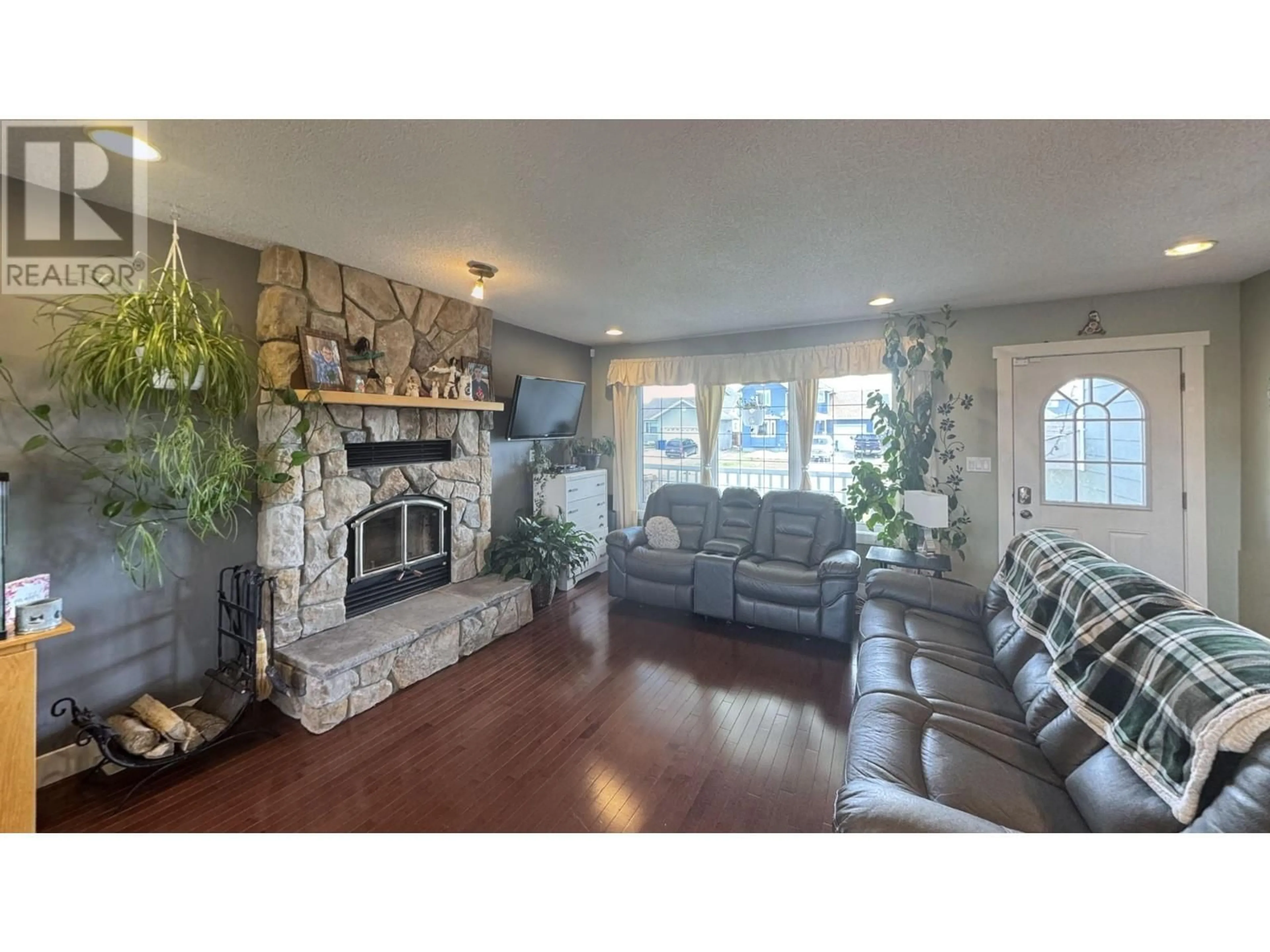 Living room with furniture, unknown for 8720 114 AVENUE, Fort St. John British Columbia V1J0C3