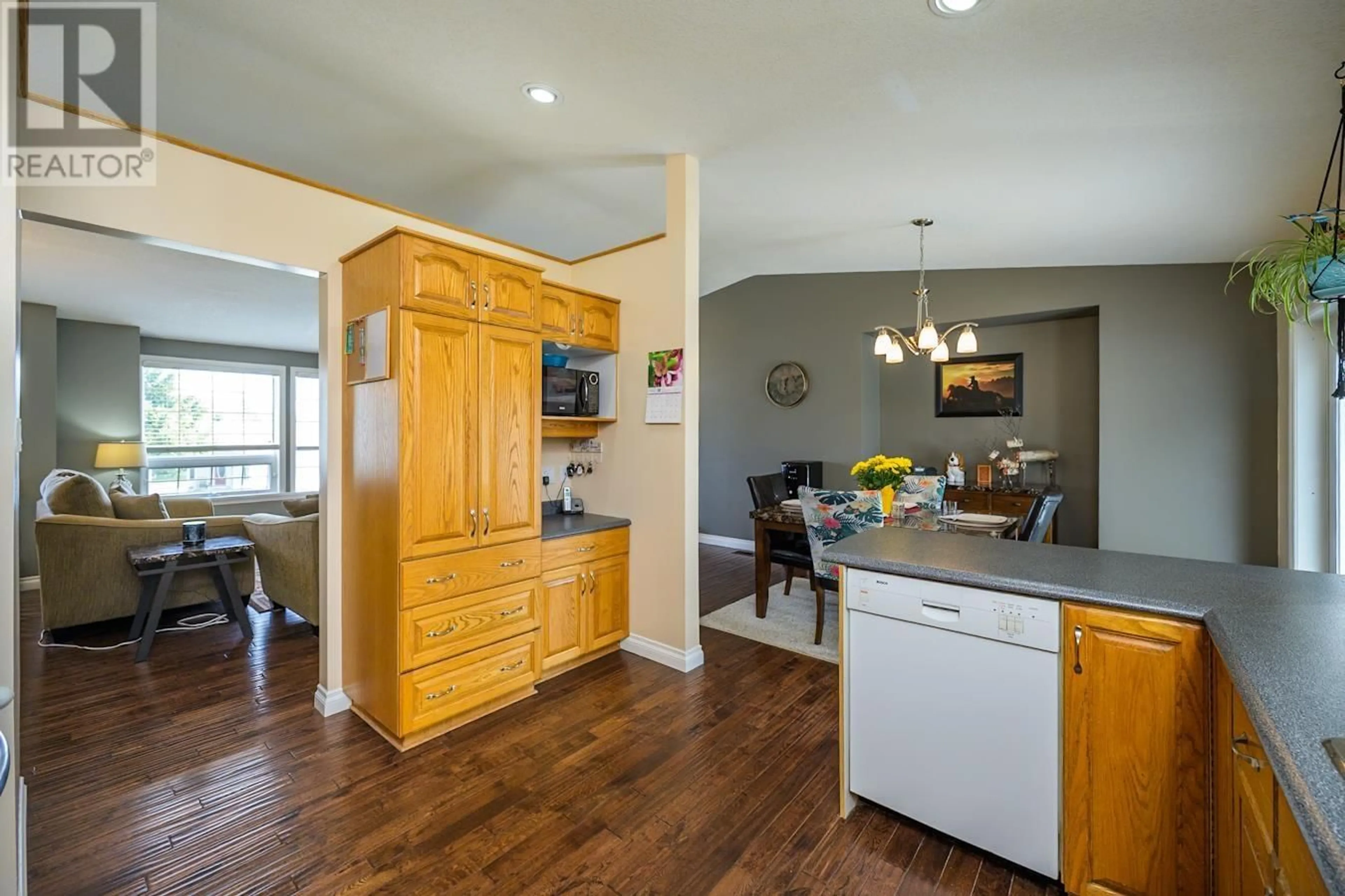 Open concept kitchen, wood/laminate floor for 3277 SETON CRESCENT, Prince George British Columbia V2K4X7