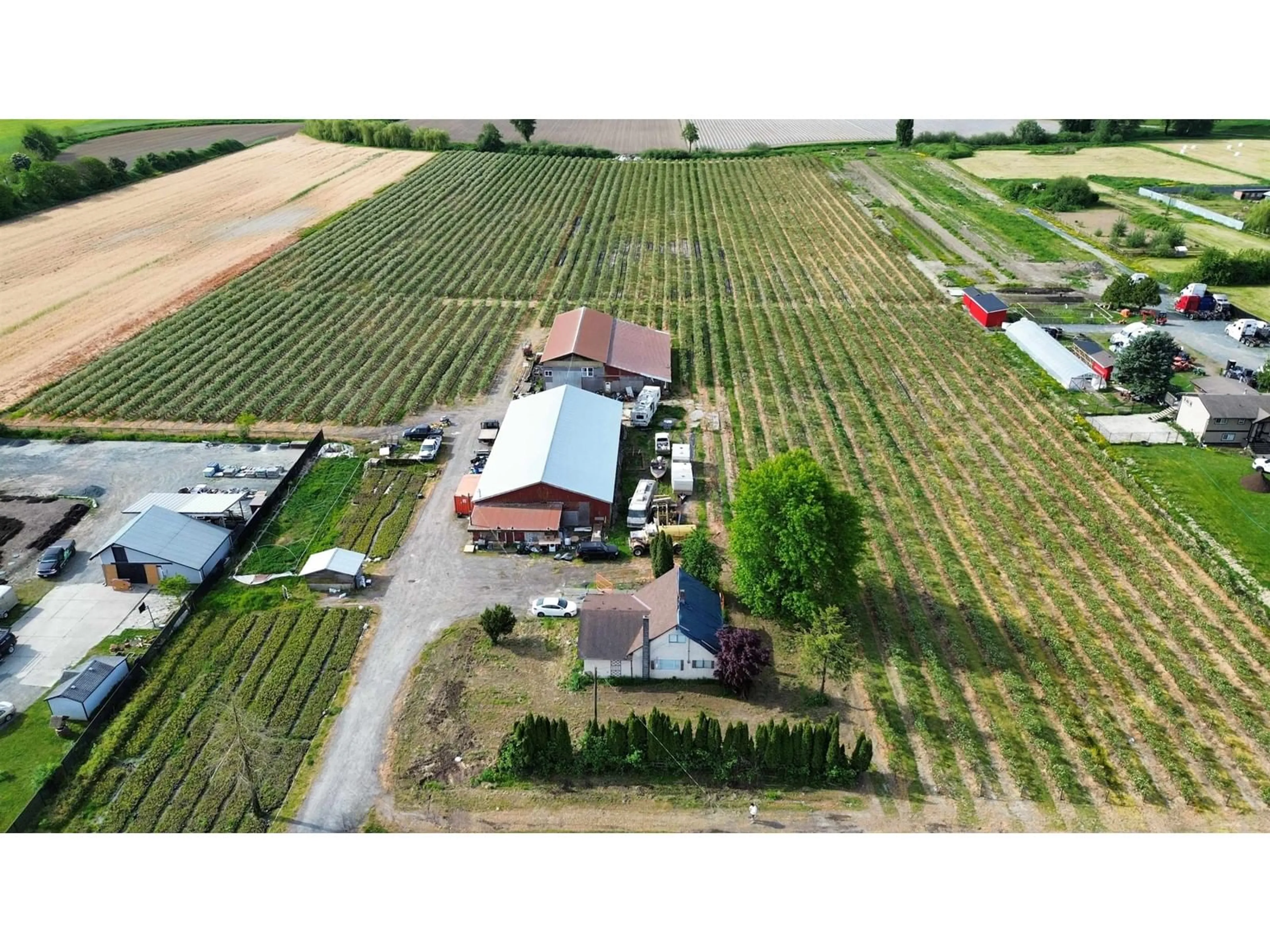A pic from outside/outdoor area/front of a property/back of a property/a pic from drone, building for 41750 KEITH WILSON ROAD, Chilliwack British Columbia V2R4B2