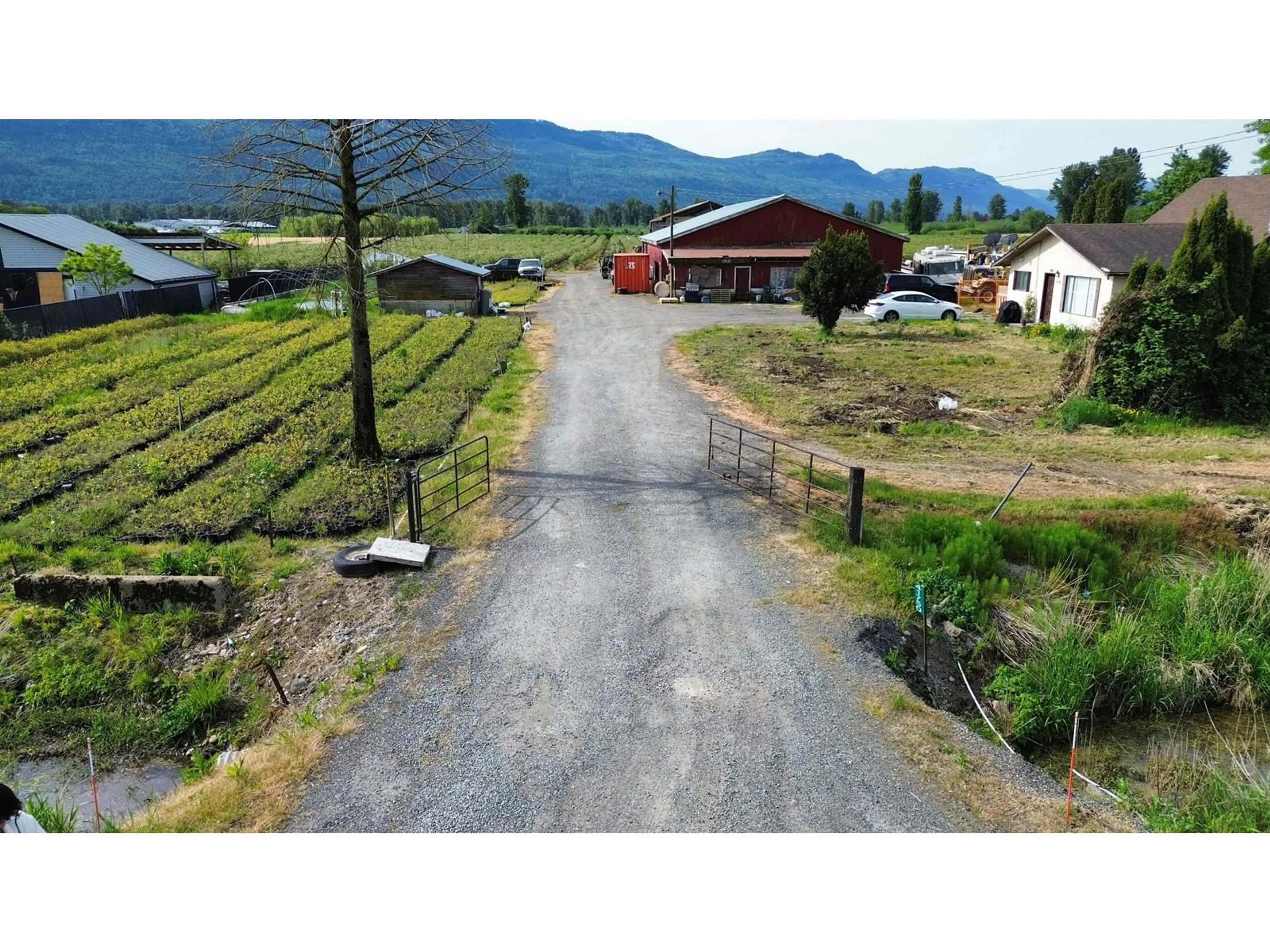 A pic from outside/outdoor area/front of a property/back of a property/a pic from drone, mountain view for 41750 KEITH WILSON ROAD, Chilliwack British Columbia V2R4B2