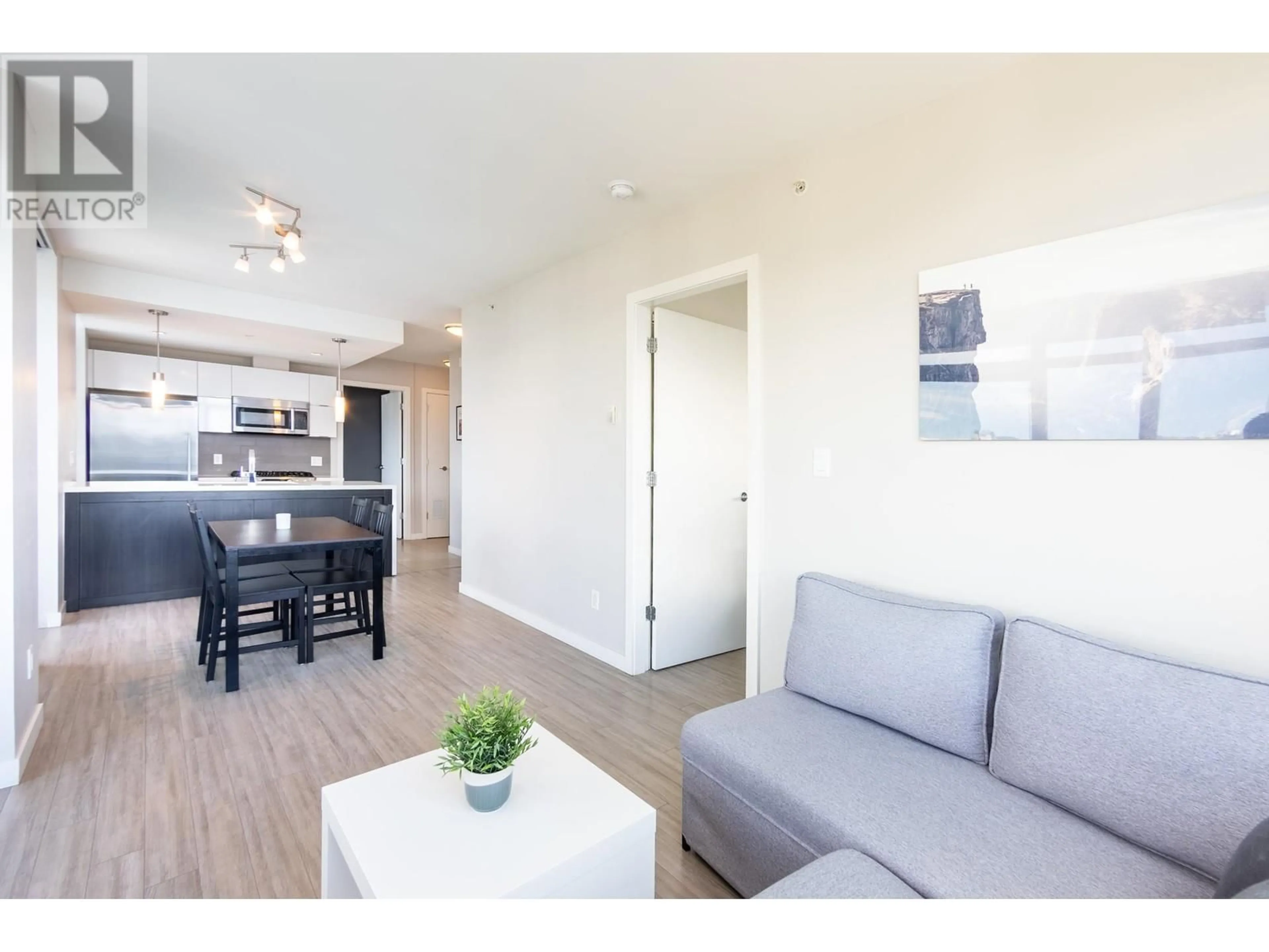 Living room with furniture, wood/laminate floor for 1702 - 1775 QUEBEC STREET, Vancouver British Columbia V5T0E3