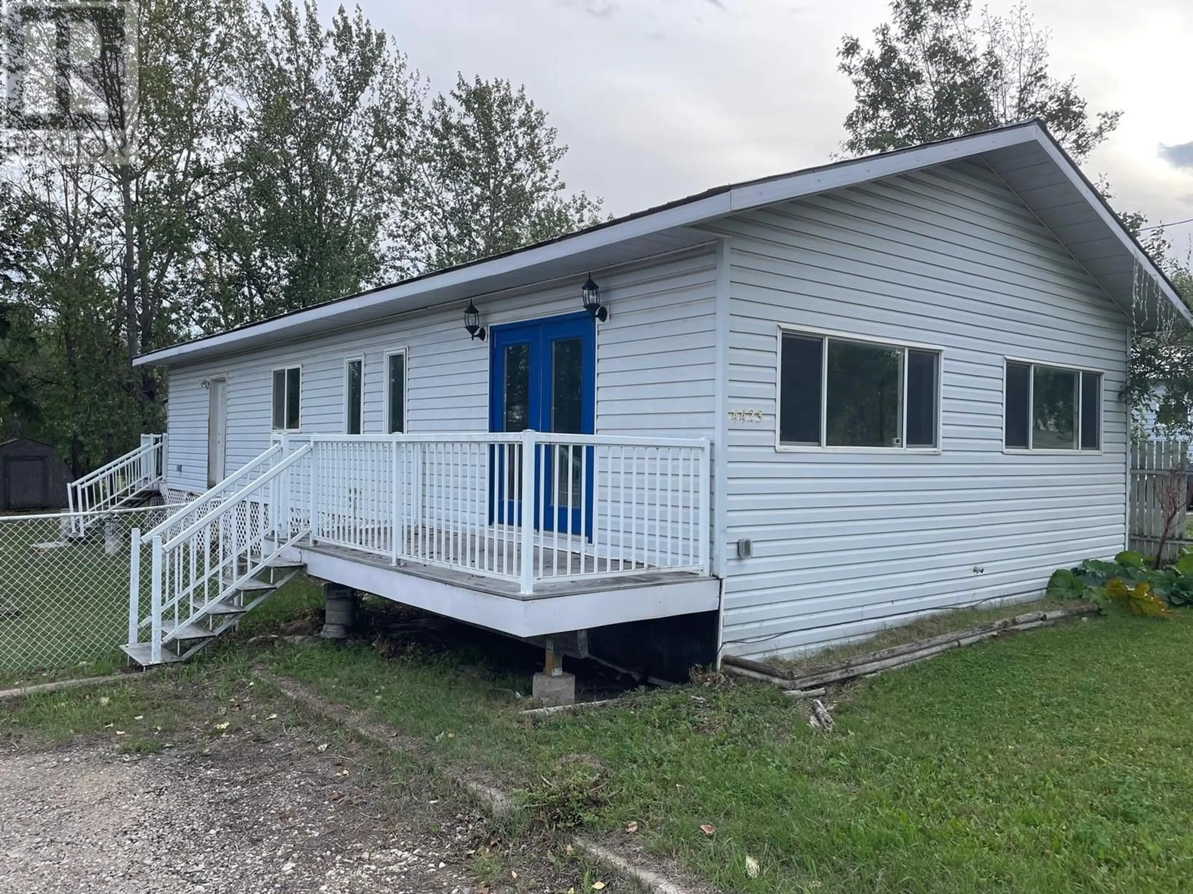 Home with vinyl exterior material, building for 4423 53 AVENUE, Fort Nelson British Columbia V0C1R0