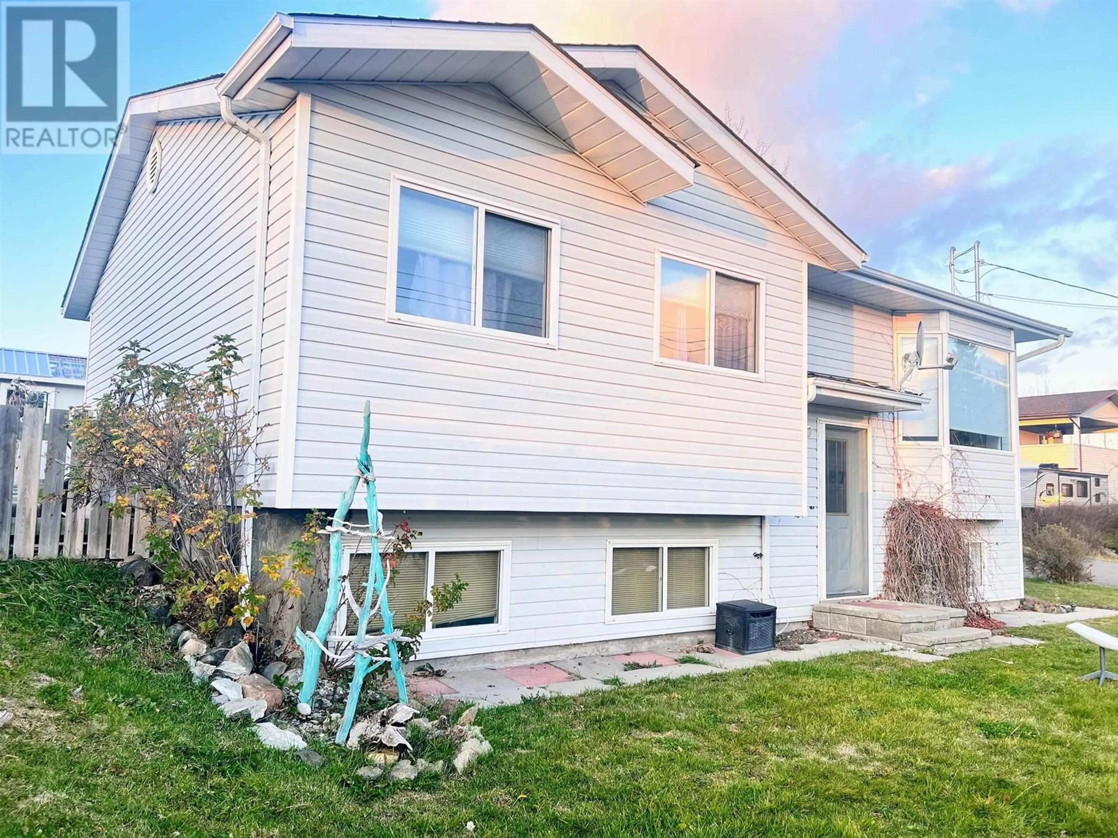 Home with vinyl exterior material, street for 487 3RD AVENUE, Burns Lake British Columbia V0J1E0