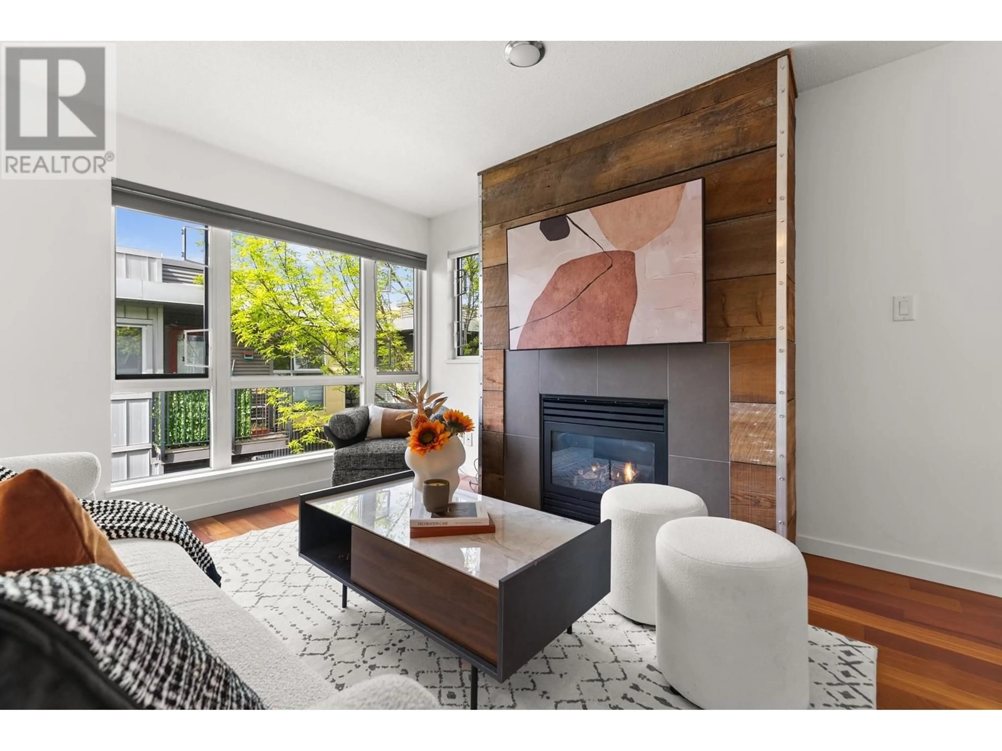 Living room with furniture, wood/laminate floor for 213 - 672 6TH AVENUE, Vancouver British Columbia V5Z1A3