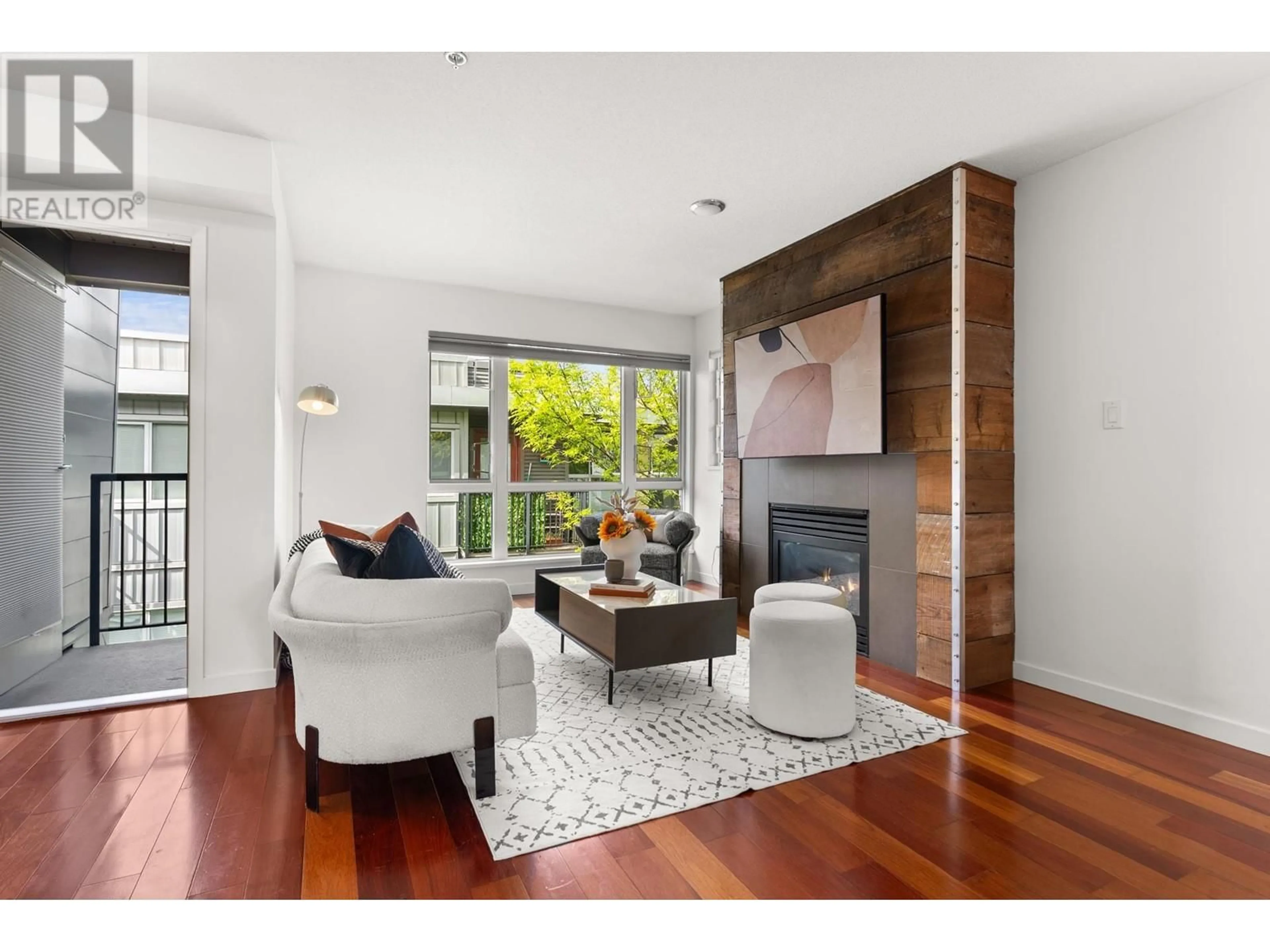 Living room with furniture, wood/laminate floor for 213 - 672 6TH AVENUE, Vancouver British Columbia V5Z1A3