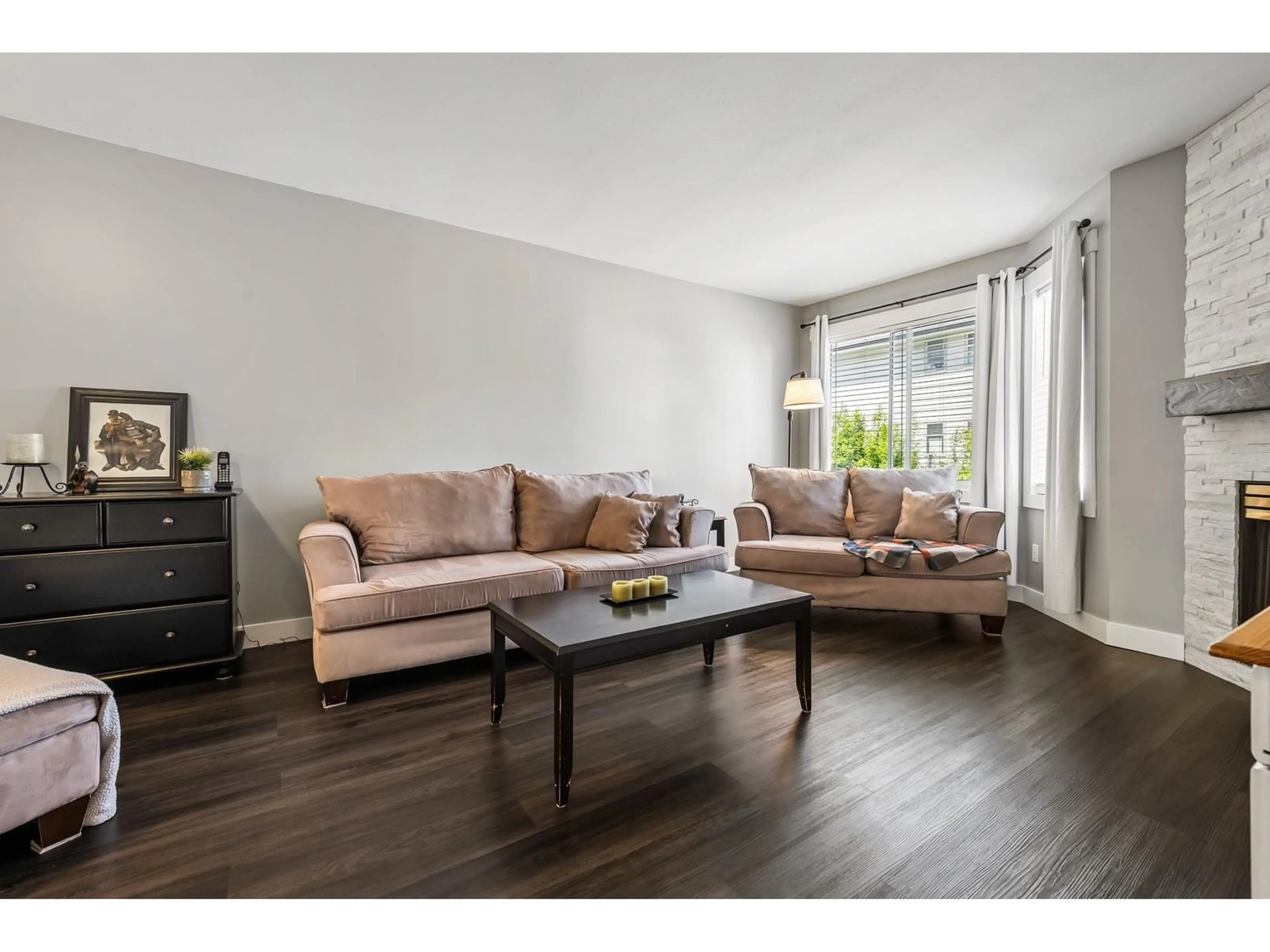 Living room with furniture, wood/laminate floor for 56 - 5904 VEDDER ROAD, Chilliwack British Columbia V2R3E7